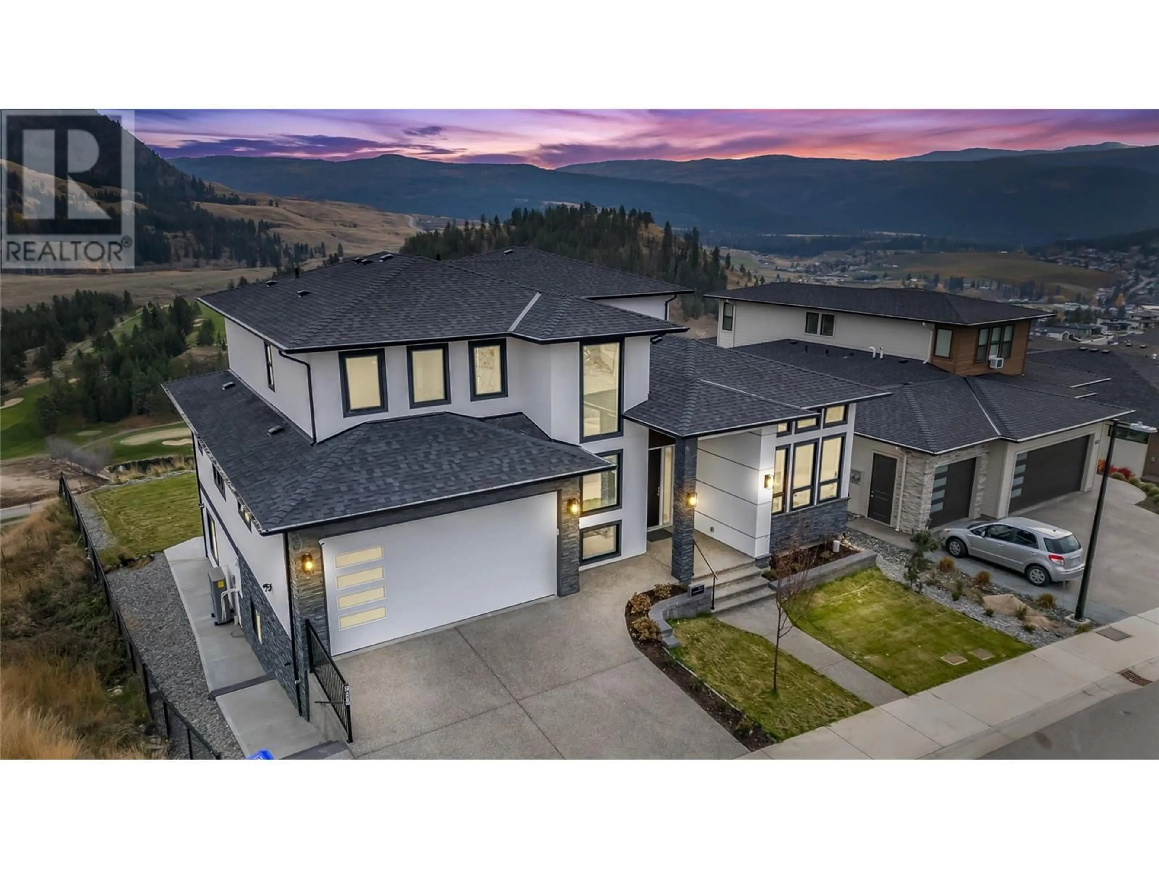 Frontside or backside of a home for 647 Carnoustie Drive, Kelowna British Columbia V1P1V2