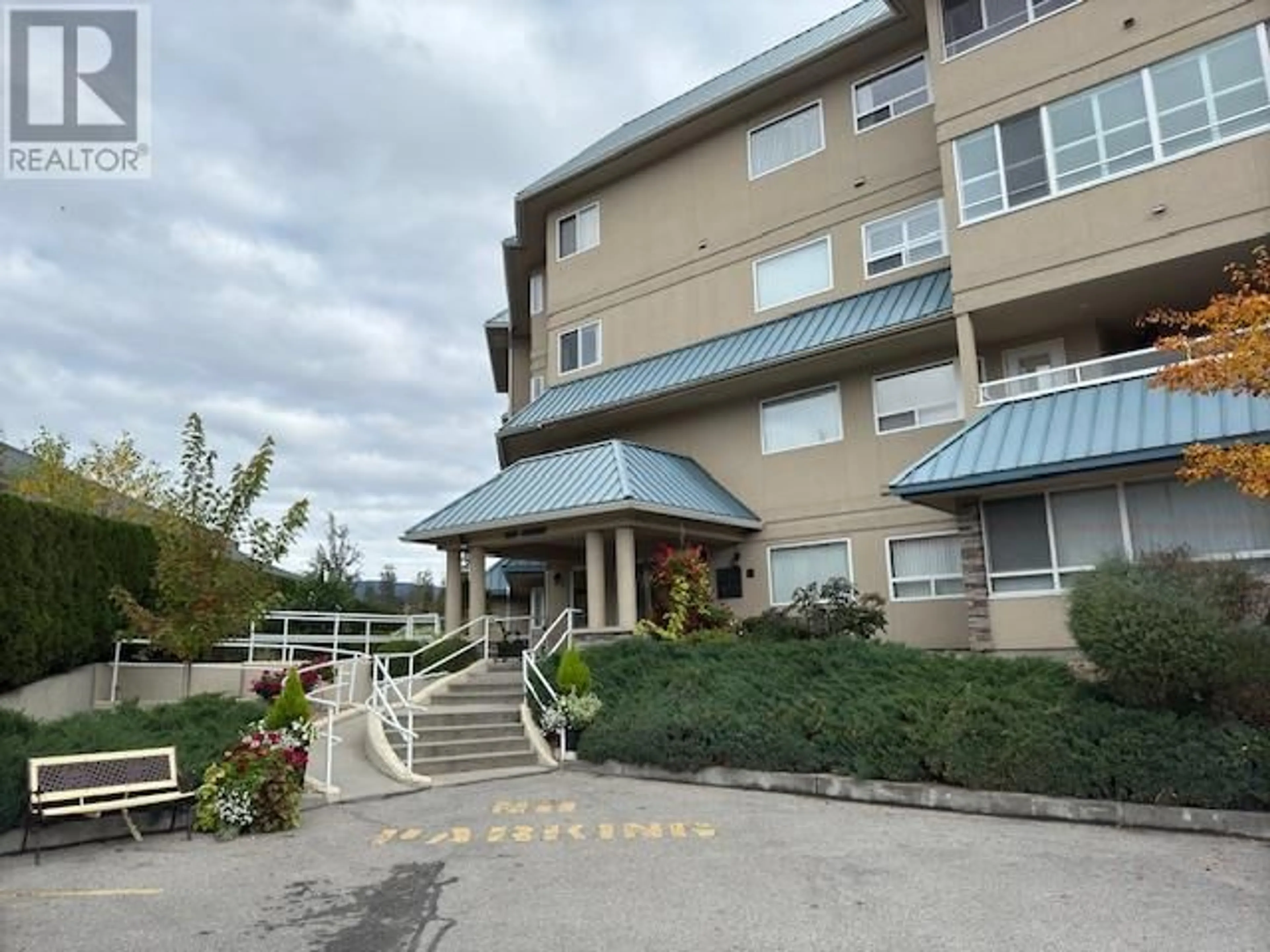 A pic from exterior of the house or condo, the front or back of building for 1961 Durnin Road Unit# 209, Kelowna British Columbia V1X7Y6