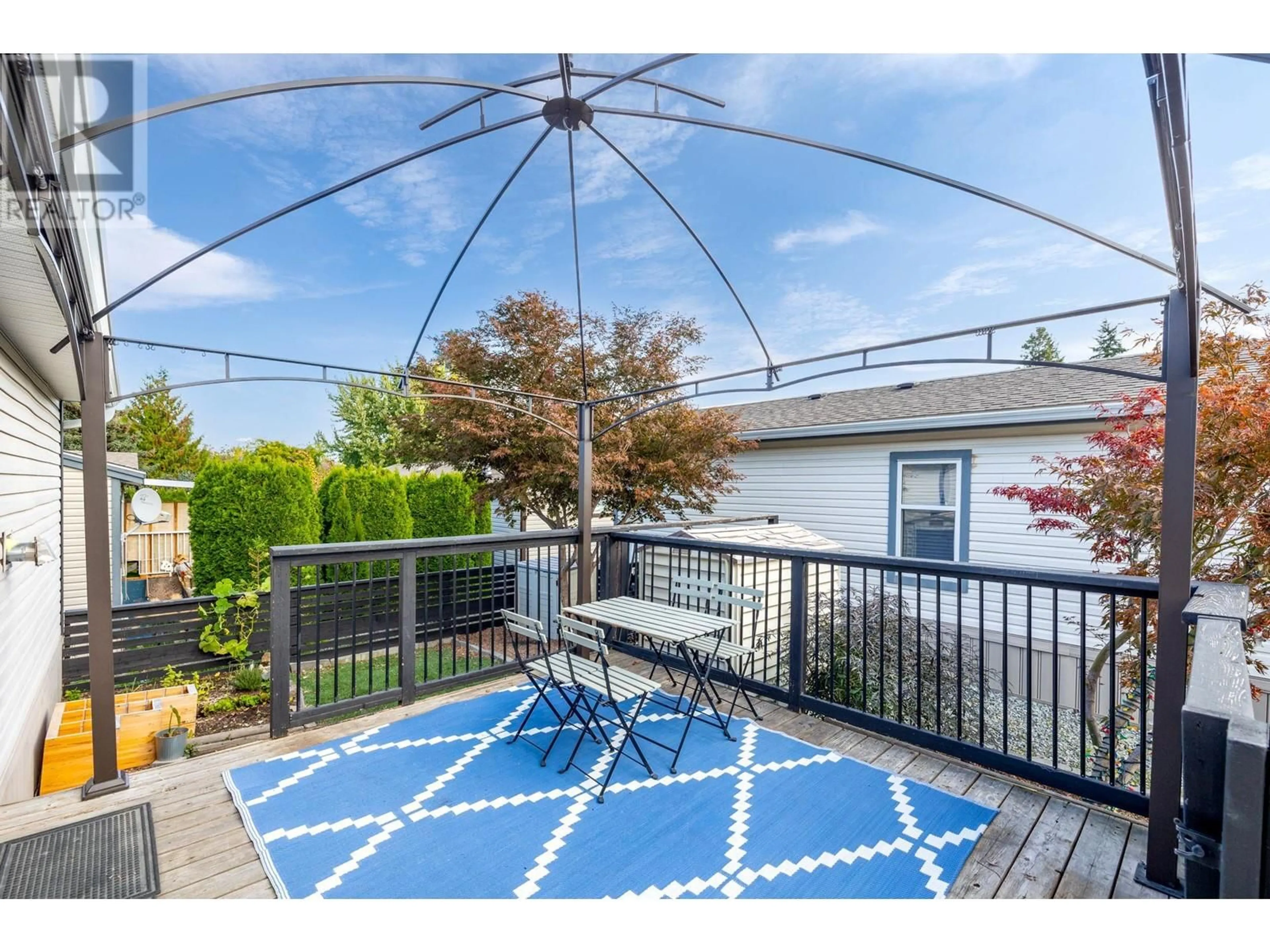 Patio, the fenced backyard for 1835 Nancee Way Court Unit# 13, West Kelowna British Columbia V1Z4C1