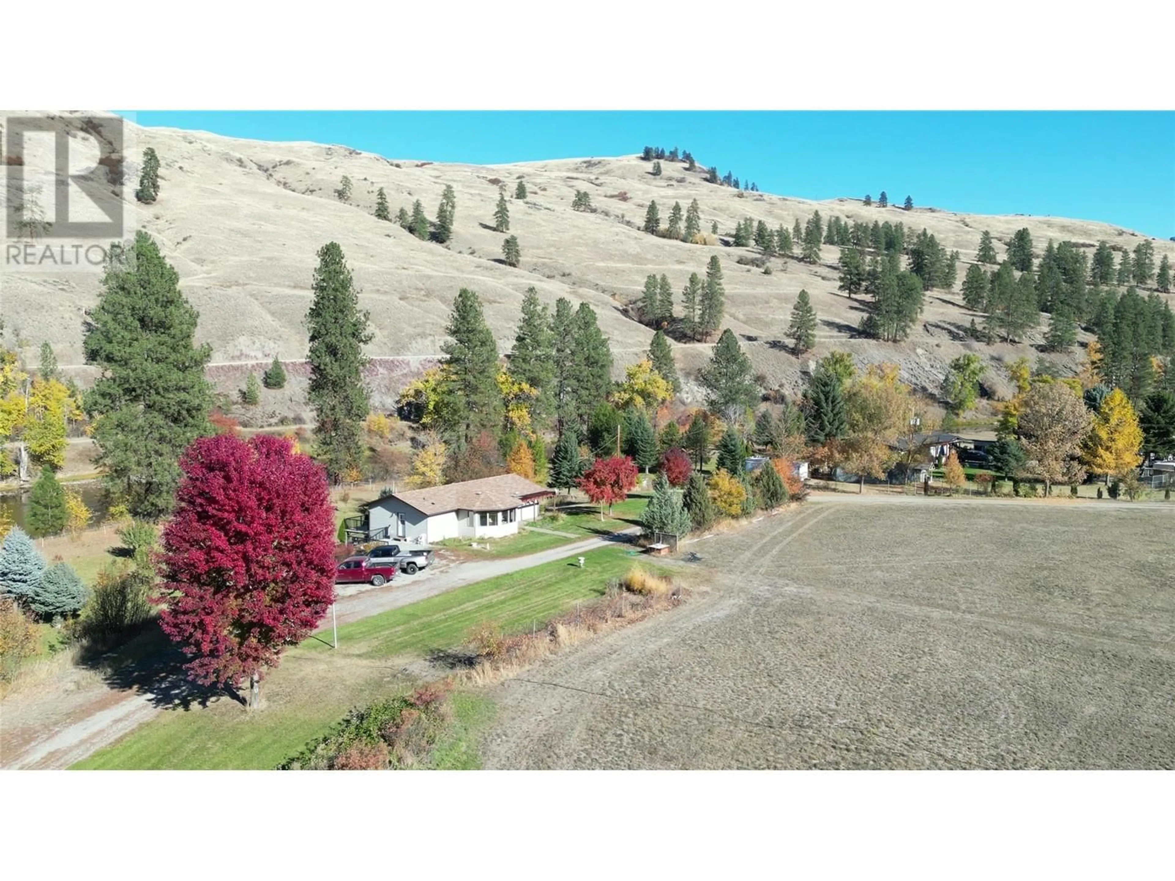 A pic from outside/outdoor area/front of a property/back of a property/a pic from drone, mountain view for 3225 HWY 3 OTHER, Rock Creek British Columbia V0H1Y0