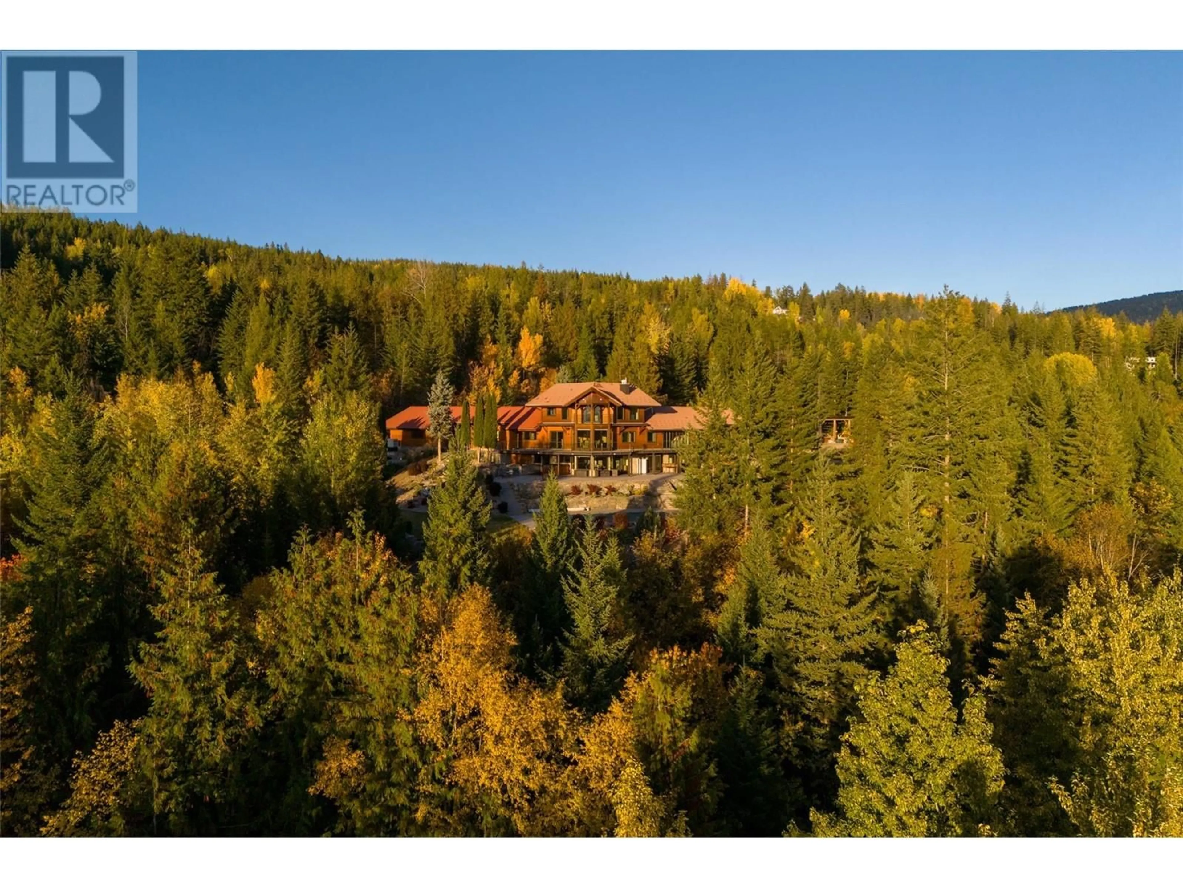 A pic from outside/outdoor area/front of a property/back of a property/a pic from drone, forest/trees view for 8100, 8104 SILVER STAR ROAD, Vernon British Columbia V1B3N1