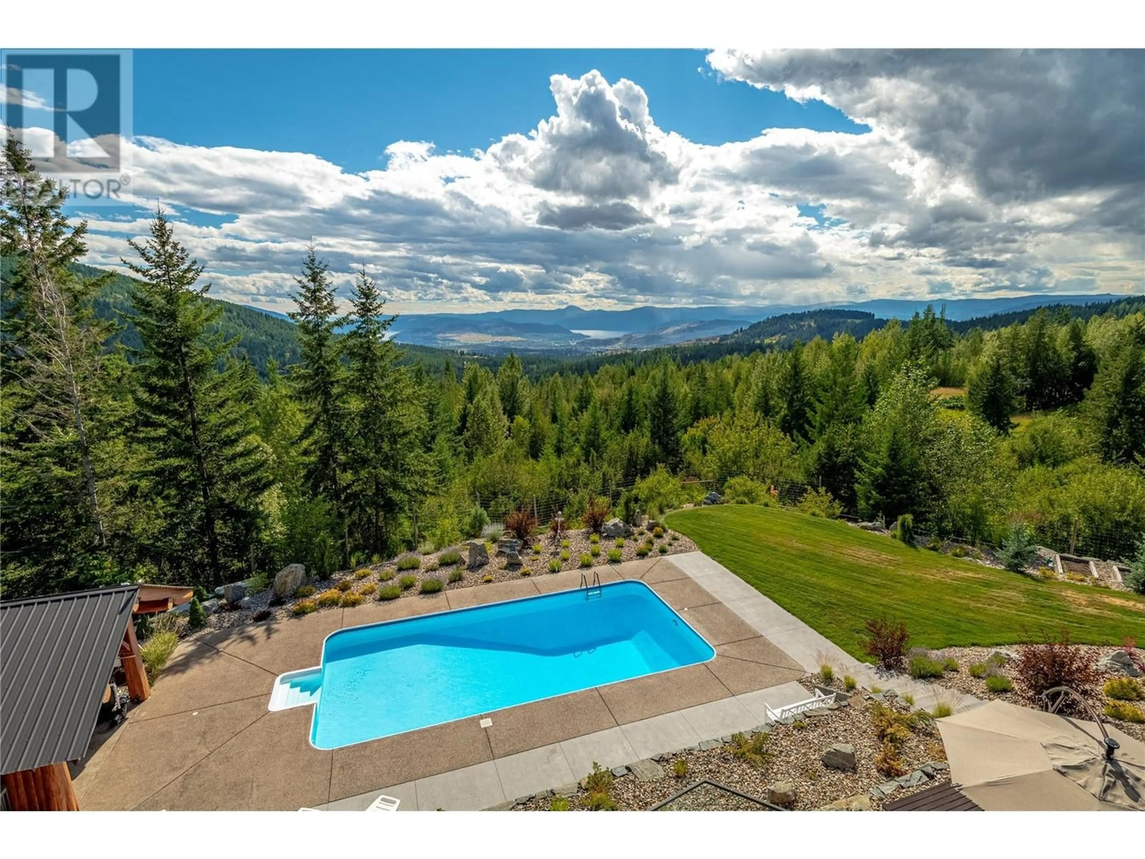 A pic from outside/outdoor area/front of a property/back of a property/a pic from drone, water/lake/river/ocean view for 8100, 8104 SILVER STAR ROAD, Vernon British Columbia V1B3N1