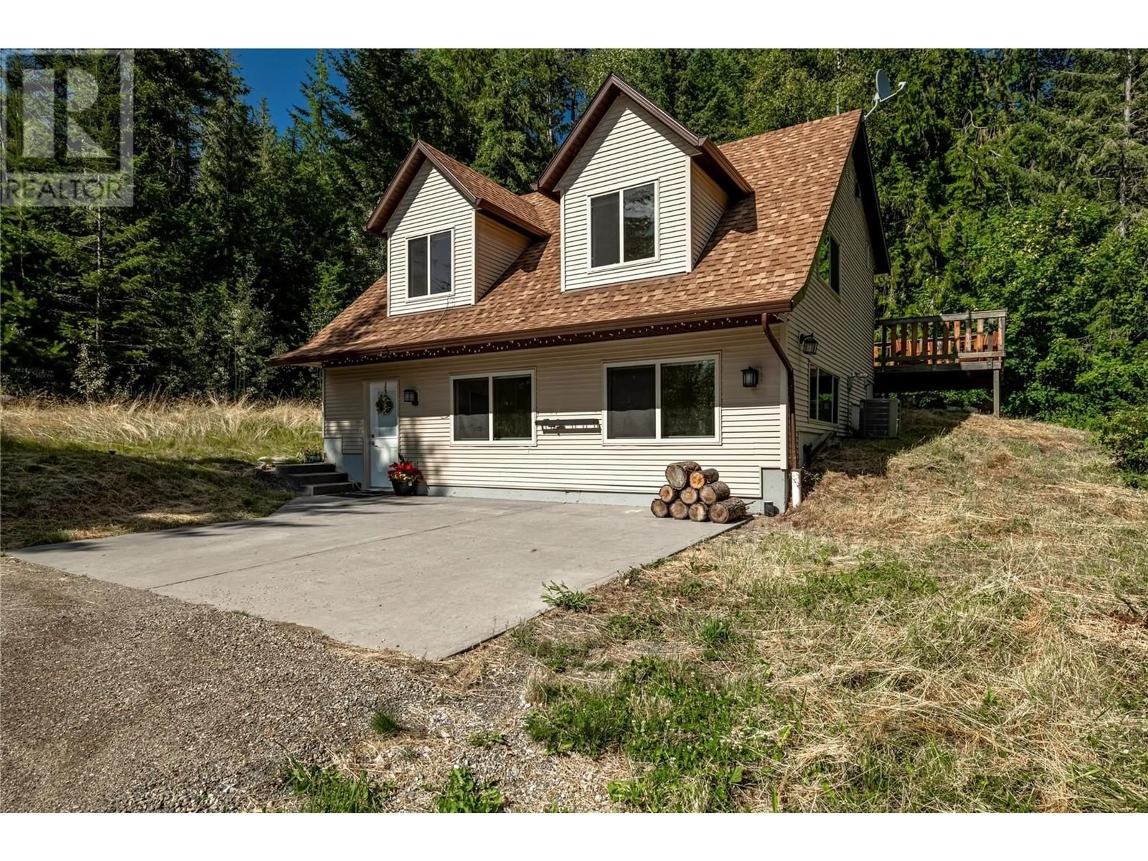 Home with vinyl exterior material, street for 8100, 8104 SILVER STAR ROAD, Vernon British Columbia V1B3N1