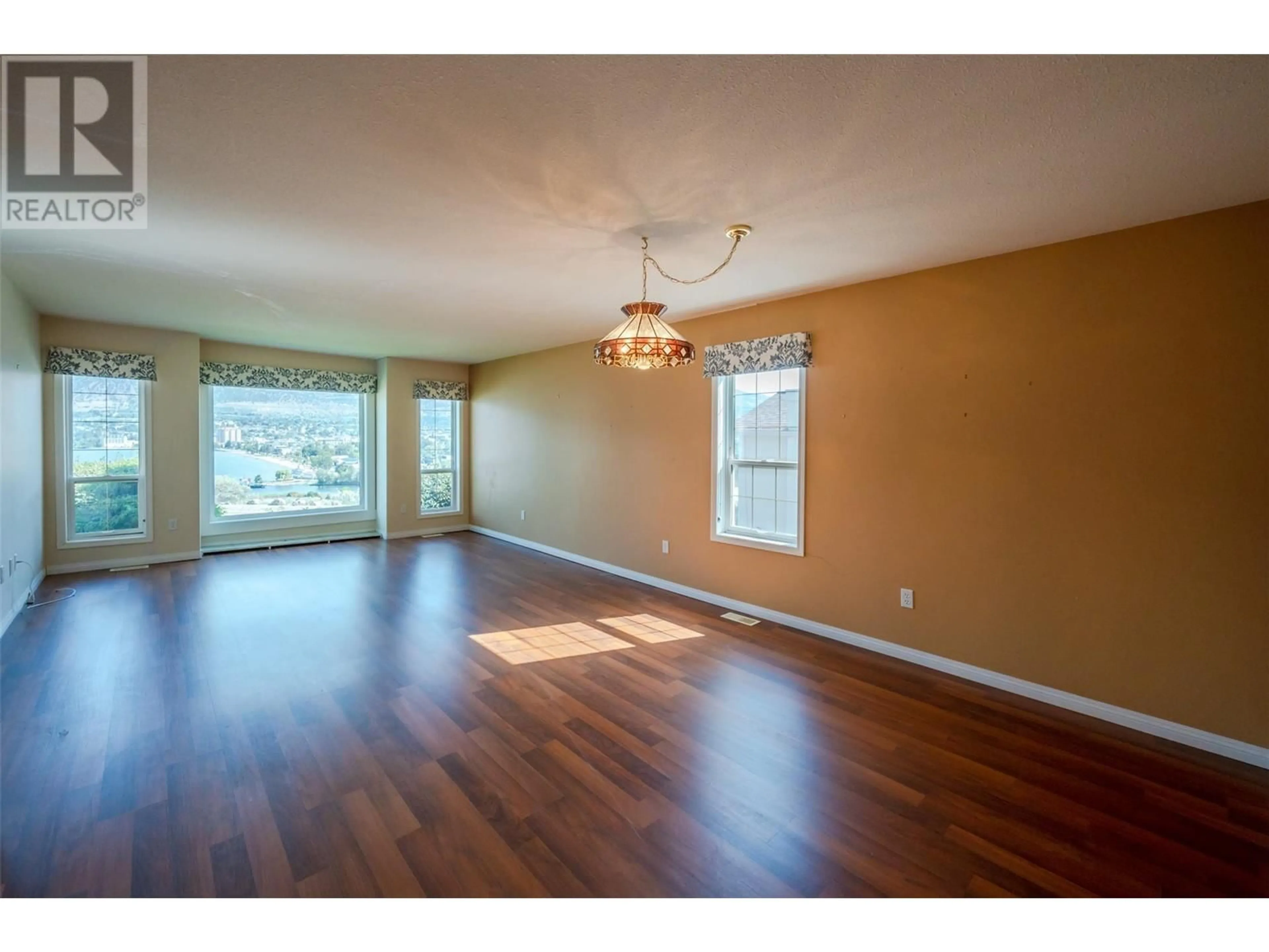 A pic of a room, wood floors for 418 Ridge Road, Penticton British Columbia V2A8N7