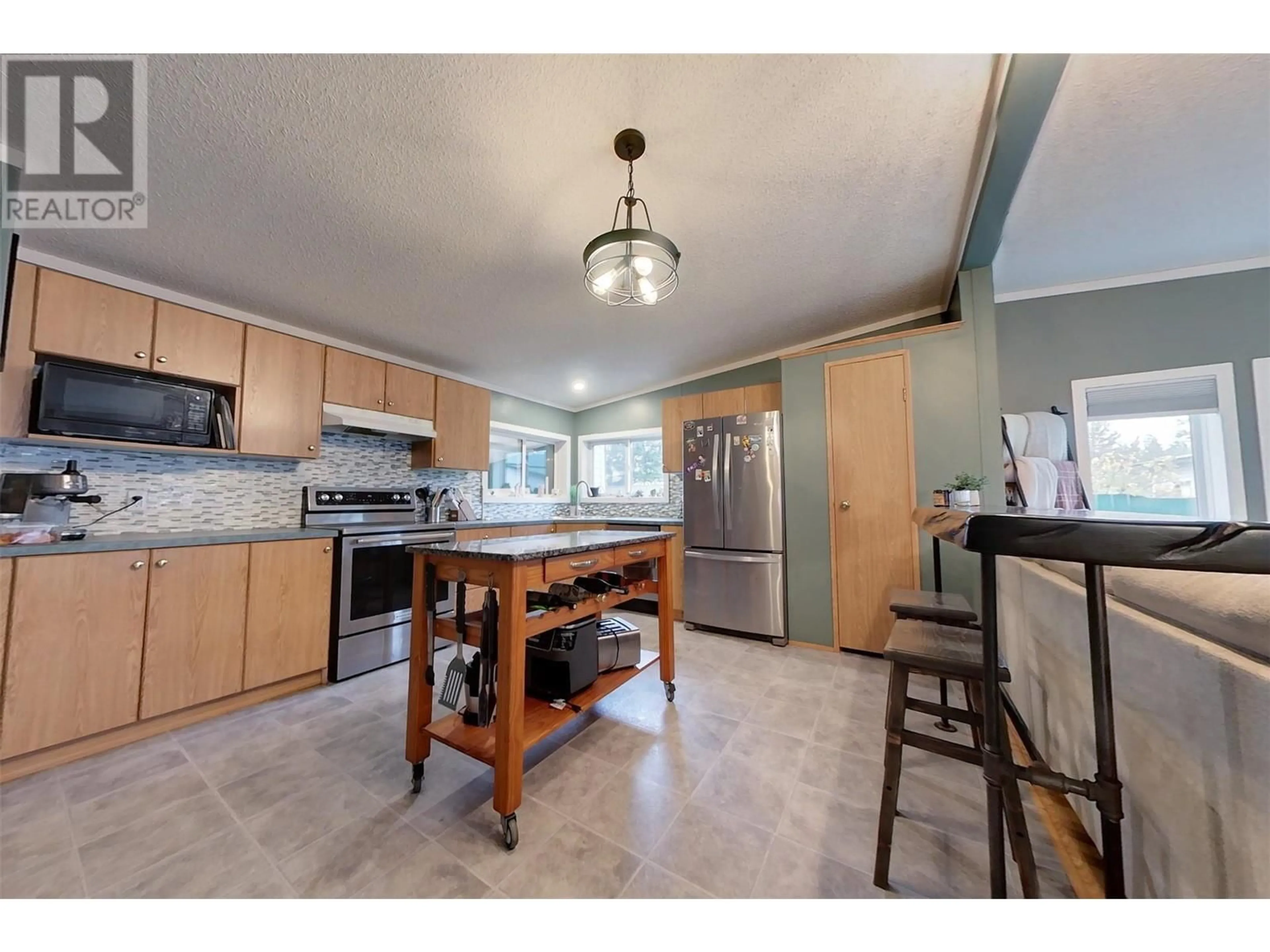 Open concept kitchen for 491 Jaffray Baynes Lake Road, Baynes Lake British Columbia V0B1T4