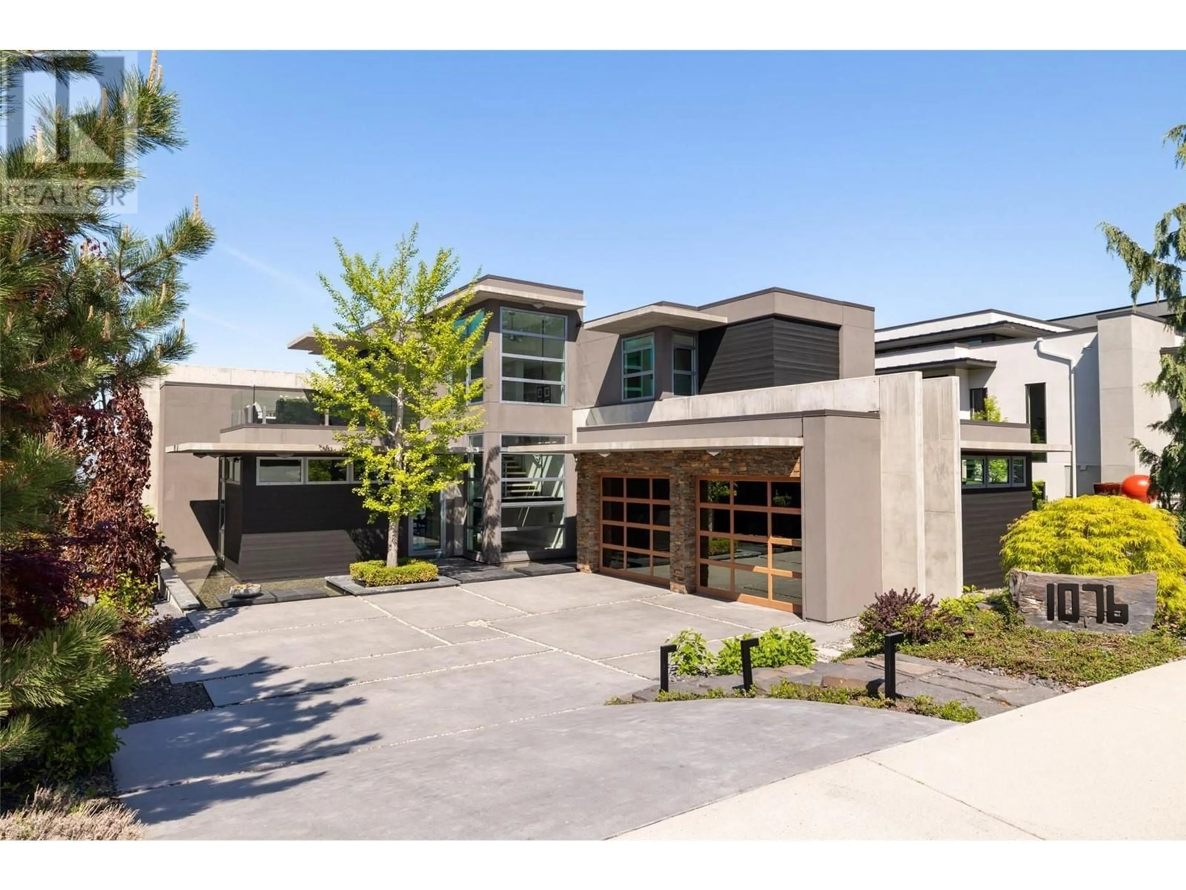 Home with brick exterior material, street for 1076 WESTPOINT DRIVE, Kelowna British Columbia V1W4Z9