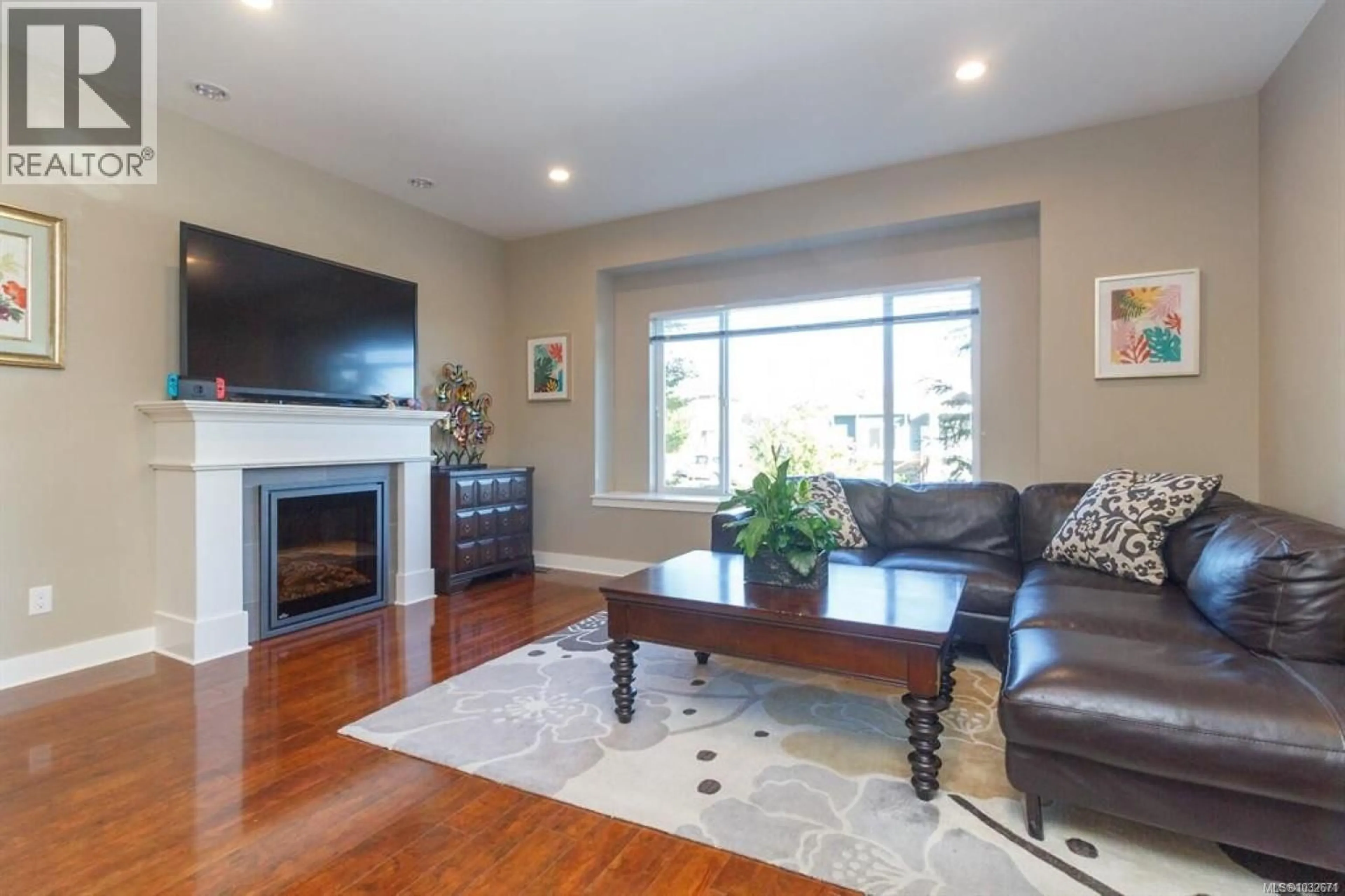 Living room with furniture, wood/laminate floor for 1227 FRESHWATER CRESCENT, Langford British Columbia V9B0L9