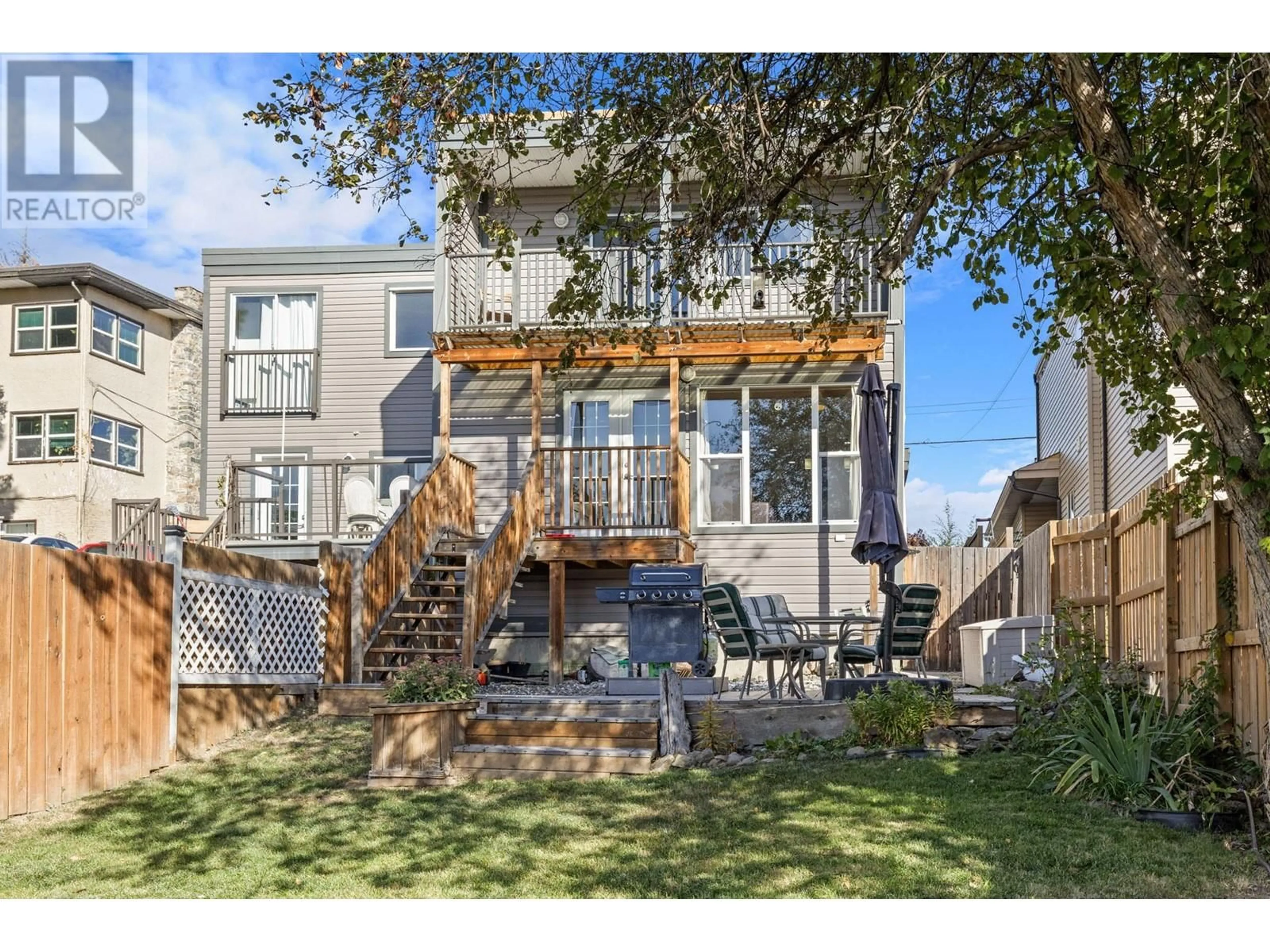 Frontside or backside of a home, the fenced backyard for 3758 Wetton Road Unit# B, West Kelowna British Columbia V4T2C1