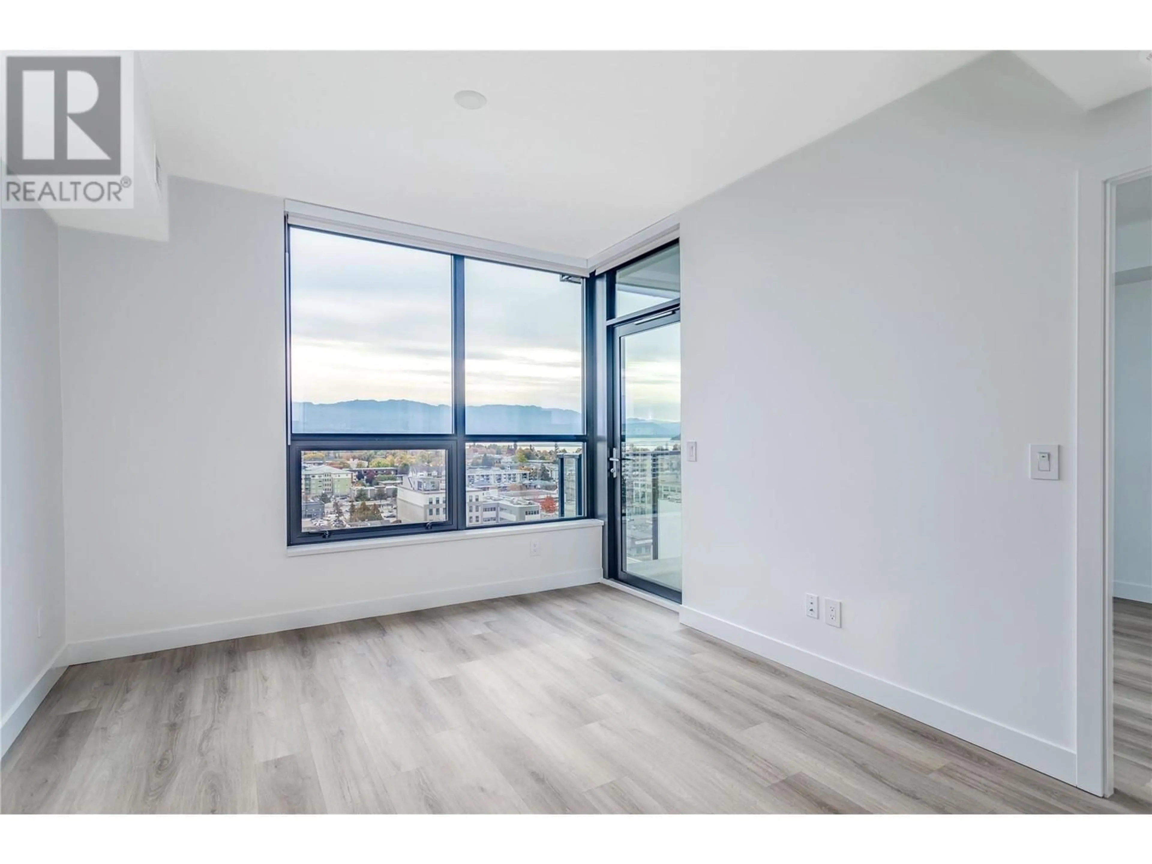 A pic of a room, wood floors for 1488 Bertram Street Unit# 1303, Kelowna British Columbia V1Y6P2