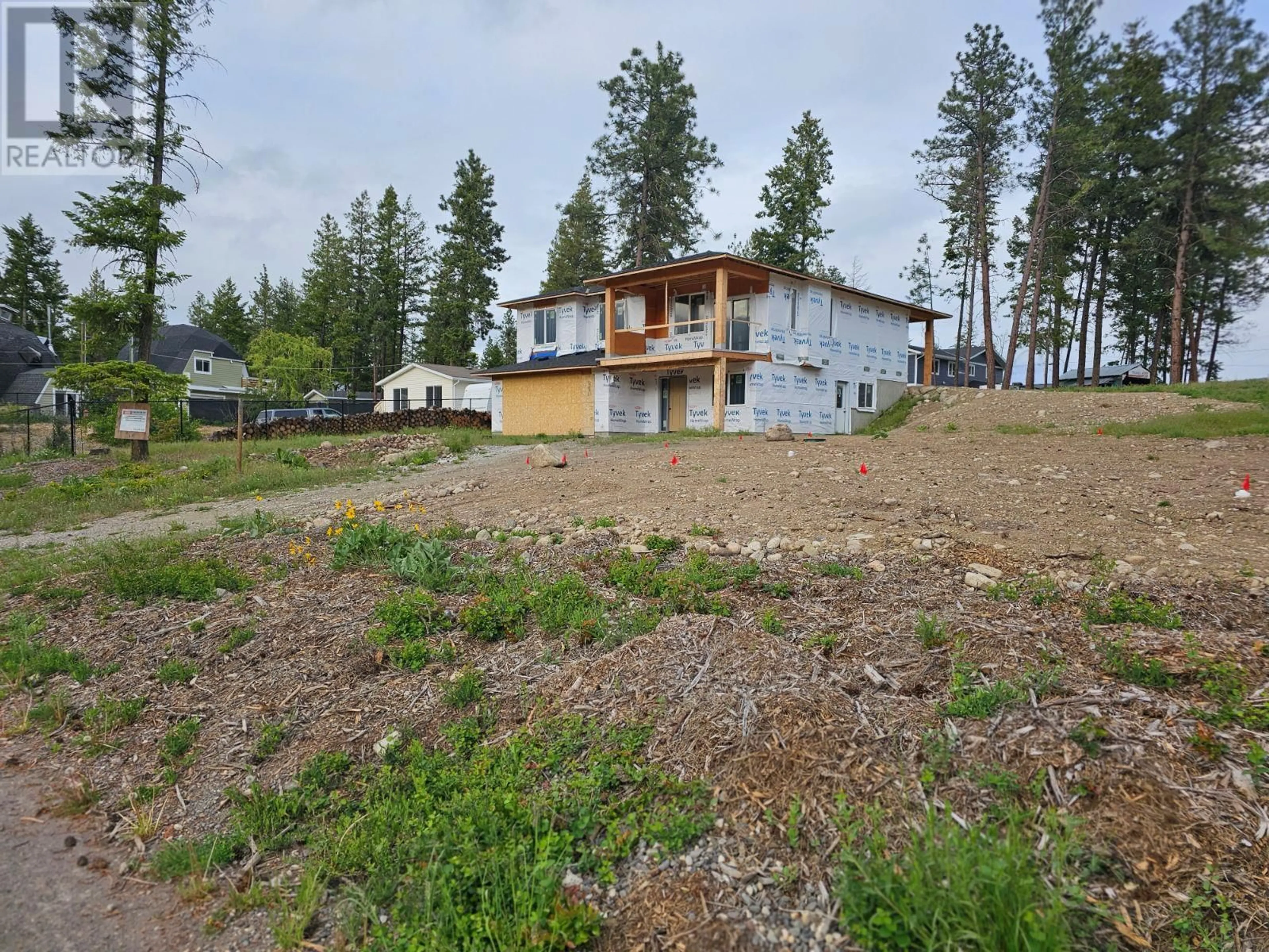 A pic from outside/outdoor area/front of a property/back of a property/a pic from drone, unknown for 7186 DUNWATERS ROAD, Kelowna British Columbia V1Z3W5