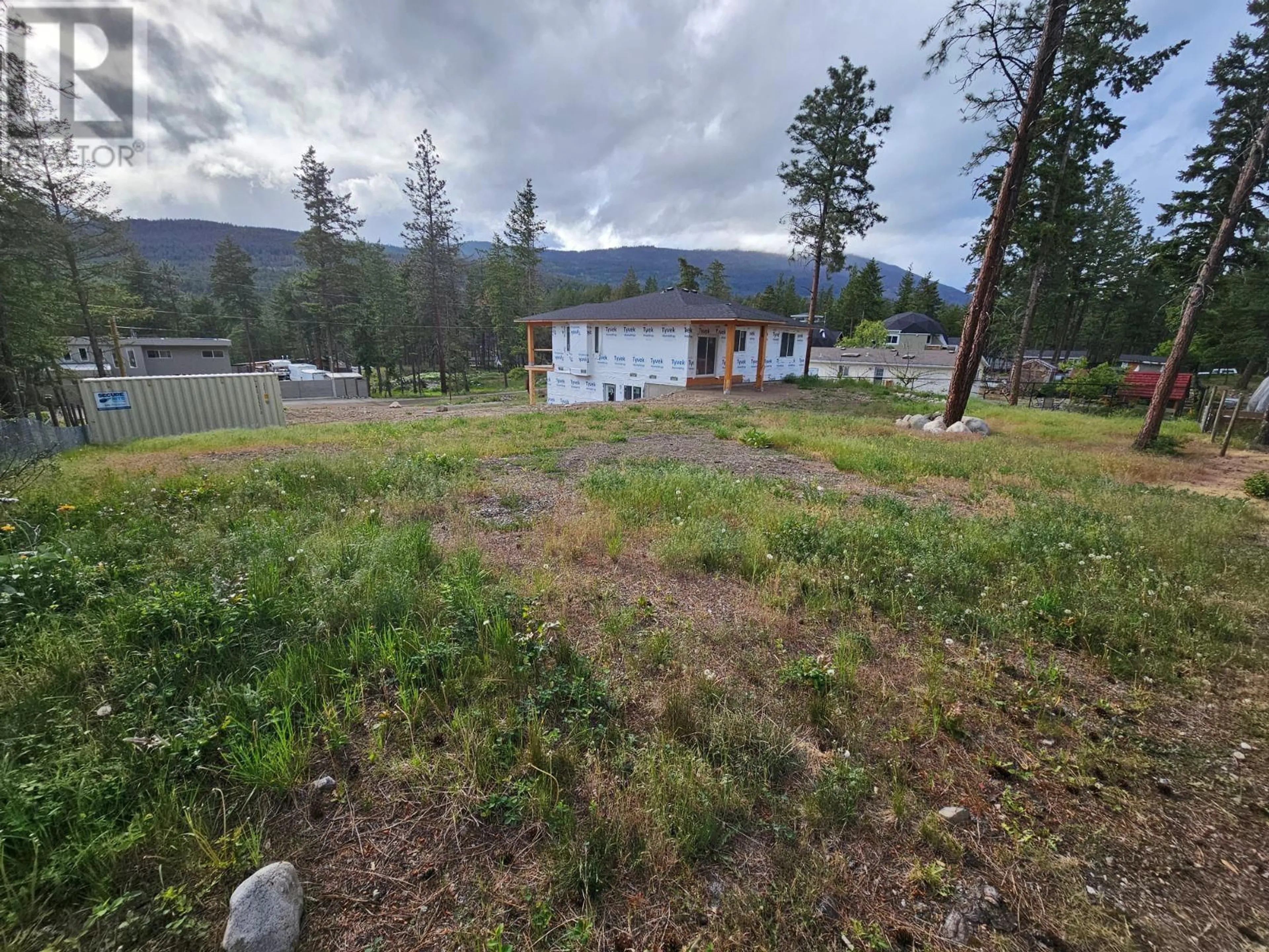 A pic from outside/outdoor area/front of a property/back of a property/a pic from drone, mountain view for 7186 DUNWATERS ROAD, Kelowna British Columbia V1Z3W5