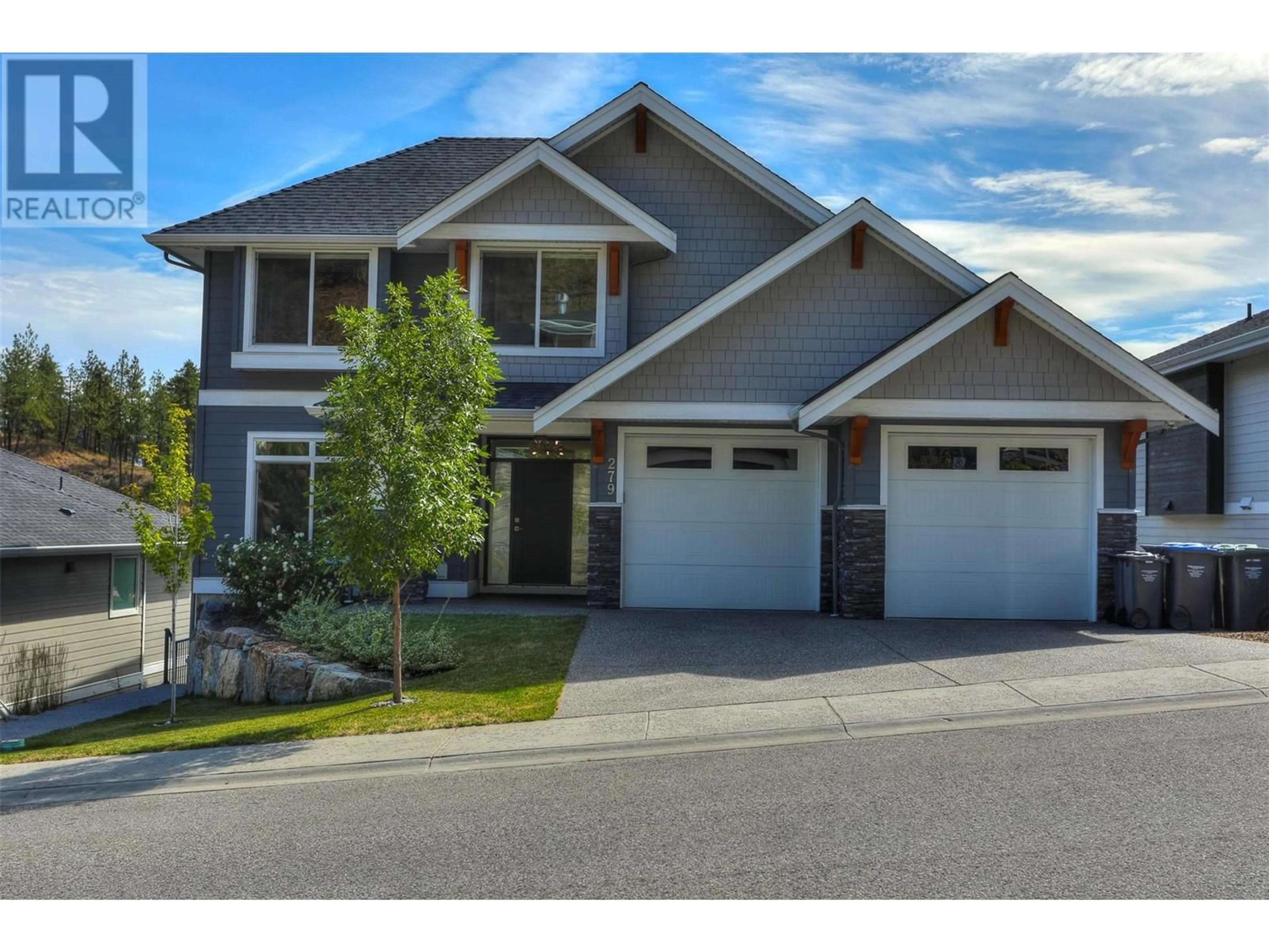 Frontside or backside of a home, the street view for 279 Upper Canyon Drive N, Kelowna British Columbia V1V3C7