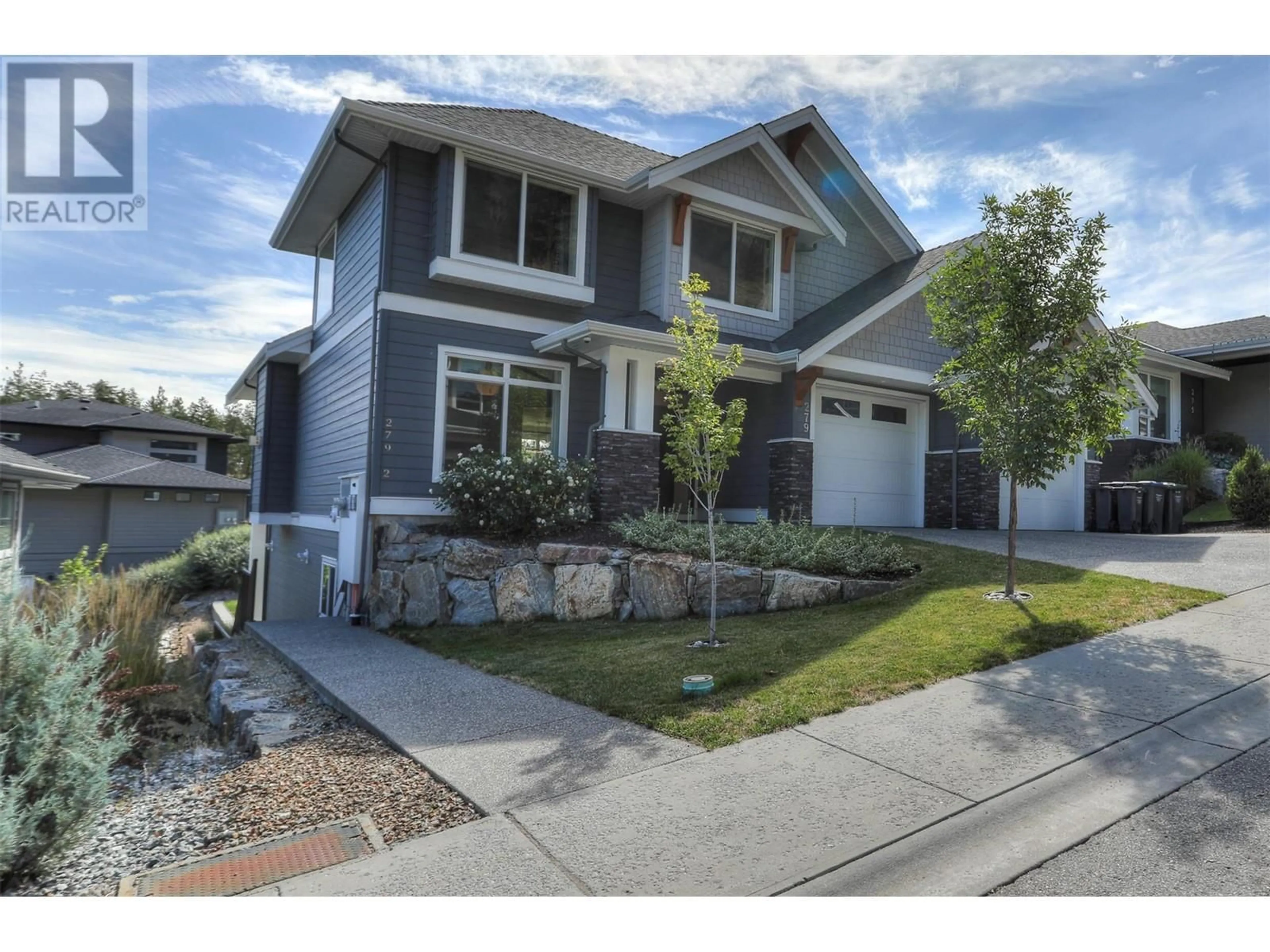 Frontside or backside of a home, the street view for 279 Upper Canyon Drive N, Kelowna British Columbia V1V3C7