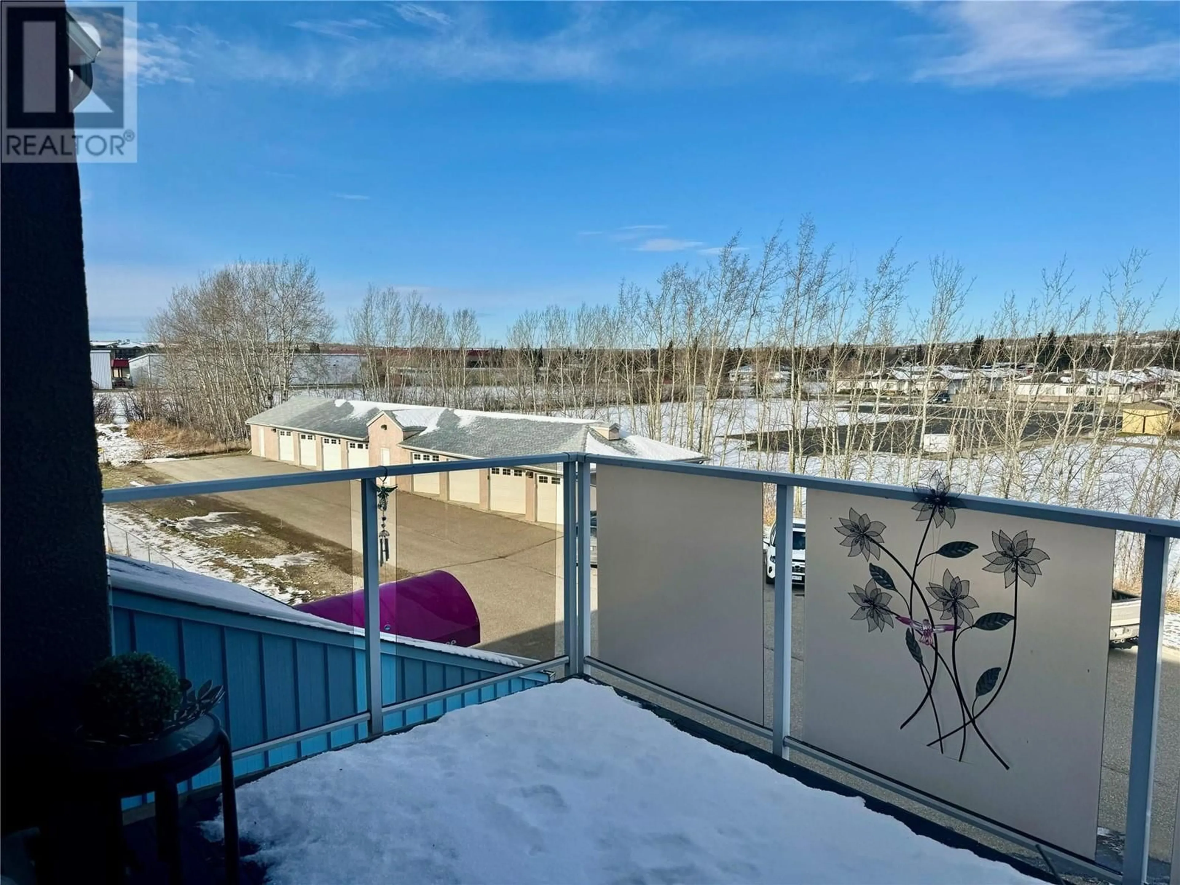 Balcony in the apartment, the fenced backyard for 301 11001 13th Street, Dawson Creek British Columbia V1G4Z8