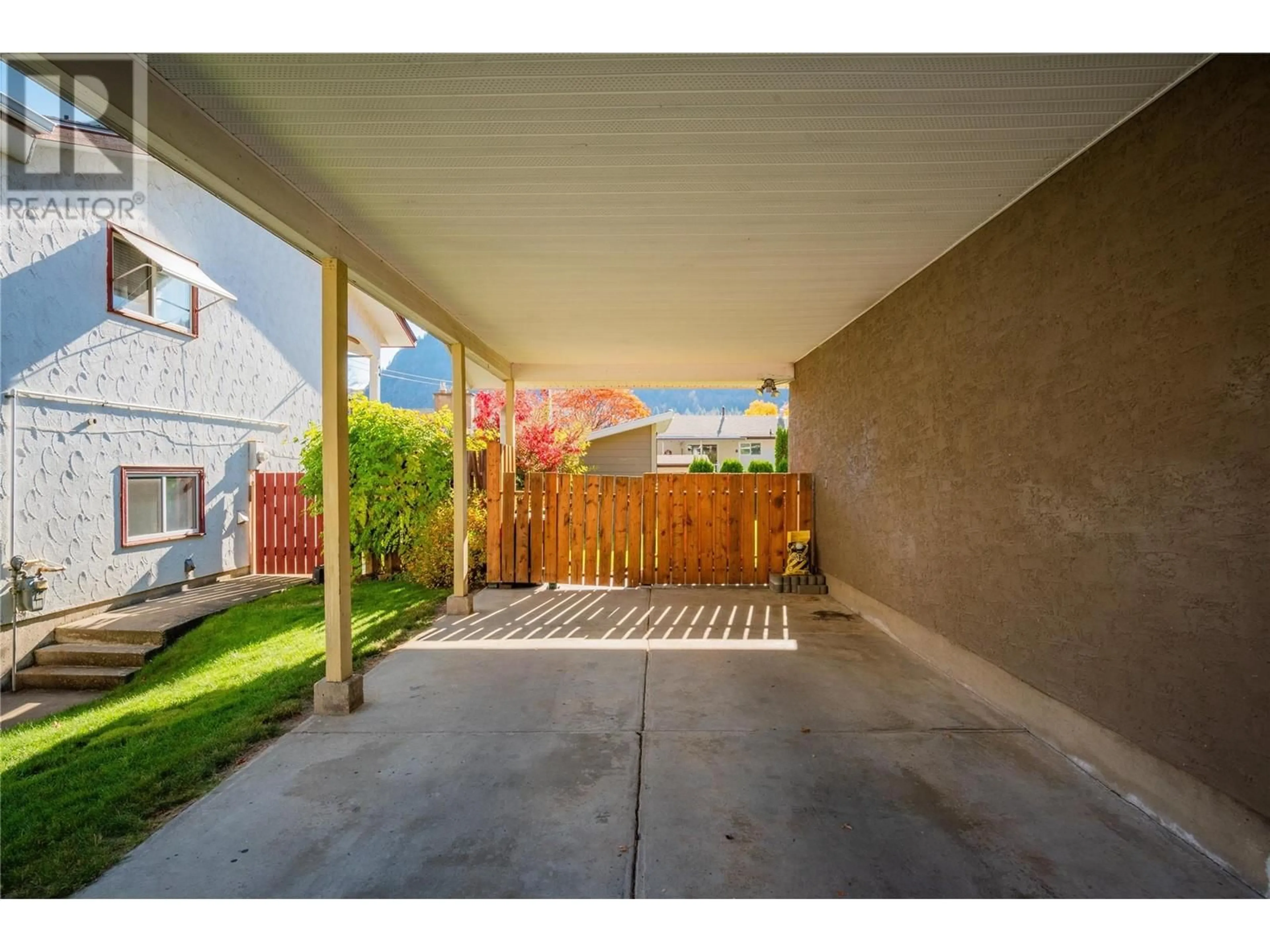 Patio, the fenced backyard for 3822 Woodland Drive, Trail British Columbia V1R2V7