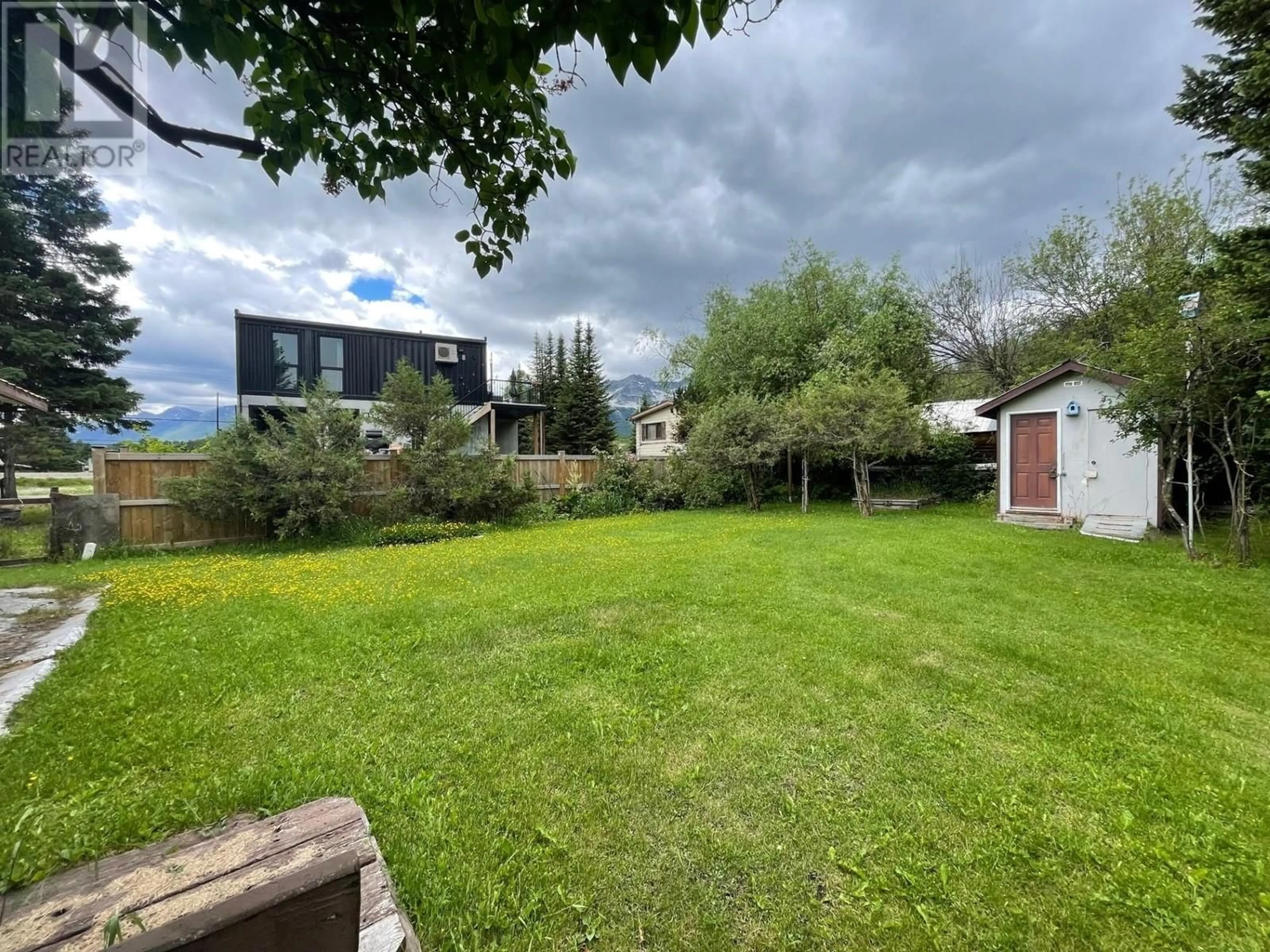 A pic from exterior of the house or condo, the fenced backyard for 230 BEAVER STREET Street, Fernie British Columbia V0B1M1