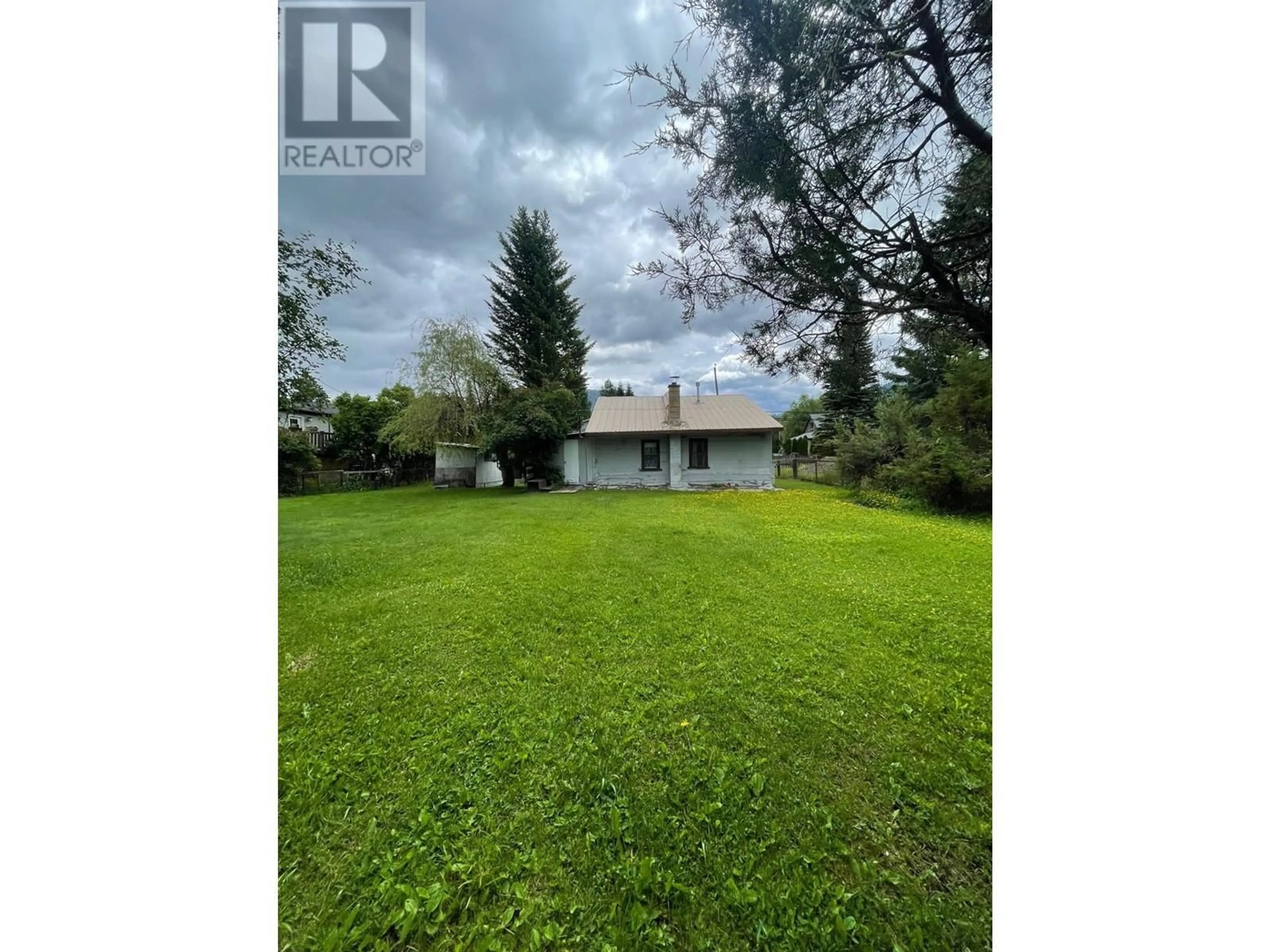 Frontside or backside of a home, the fenced backyard for 230 BEAVER STREET Street, Fernie British Columbia V0B1M1