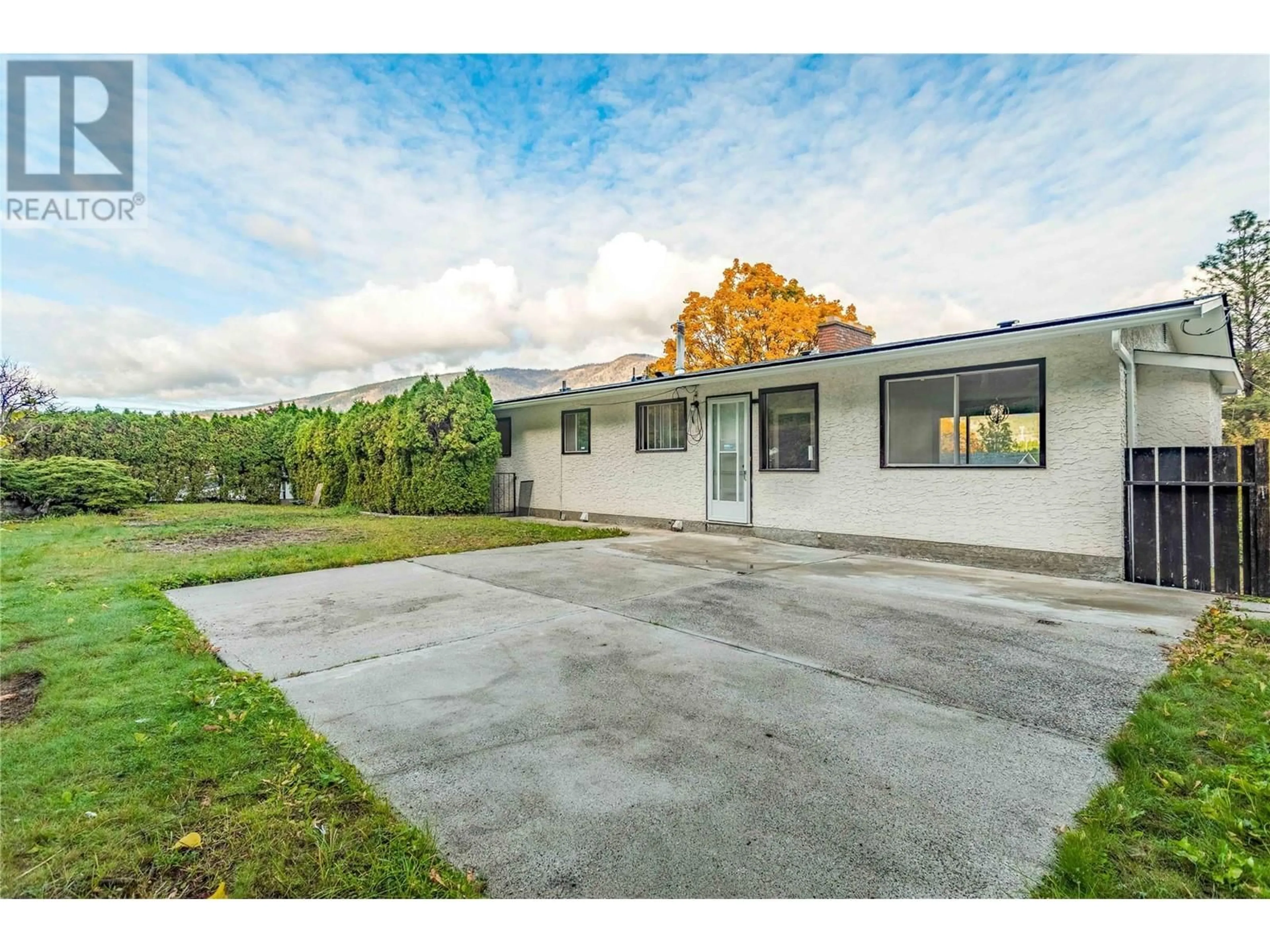 Frontside or backside of a home, the street view for 1445 Ponderosa Road, West Kelowna British Columbia V1Z1M9