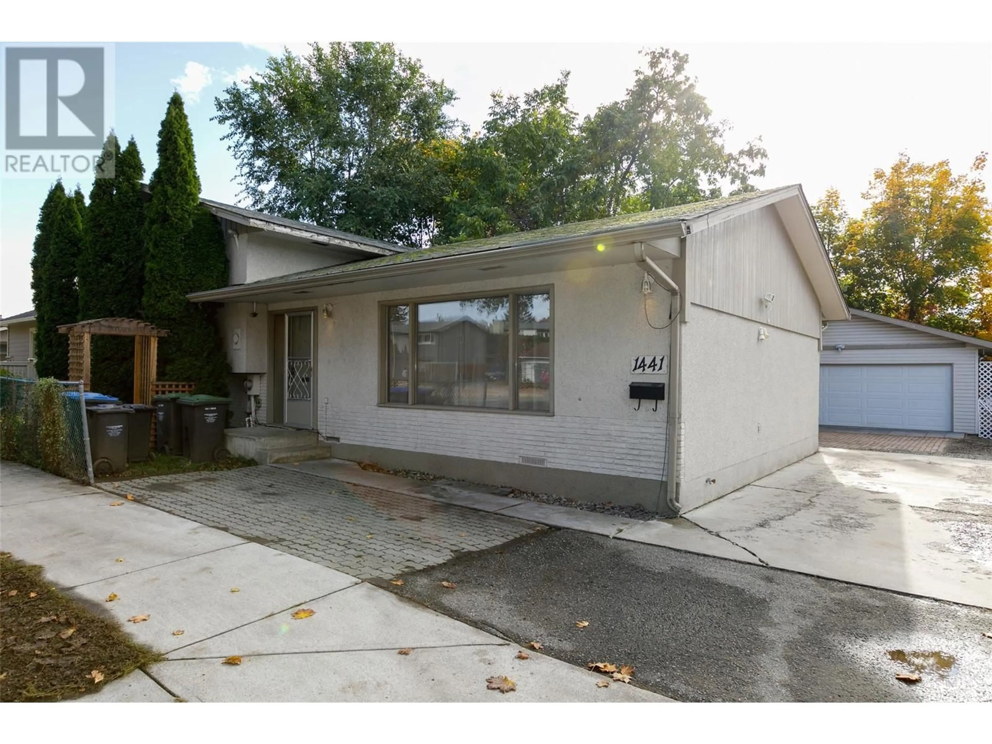 Frontside or backside of a home, the street view for 1441 Springfield Road, Kelowna British Columbia V1Y5V2