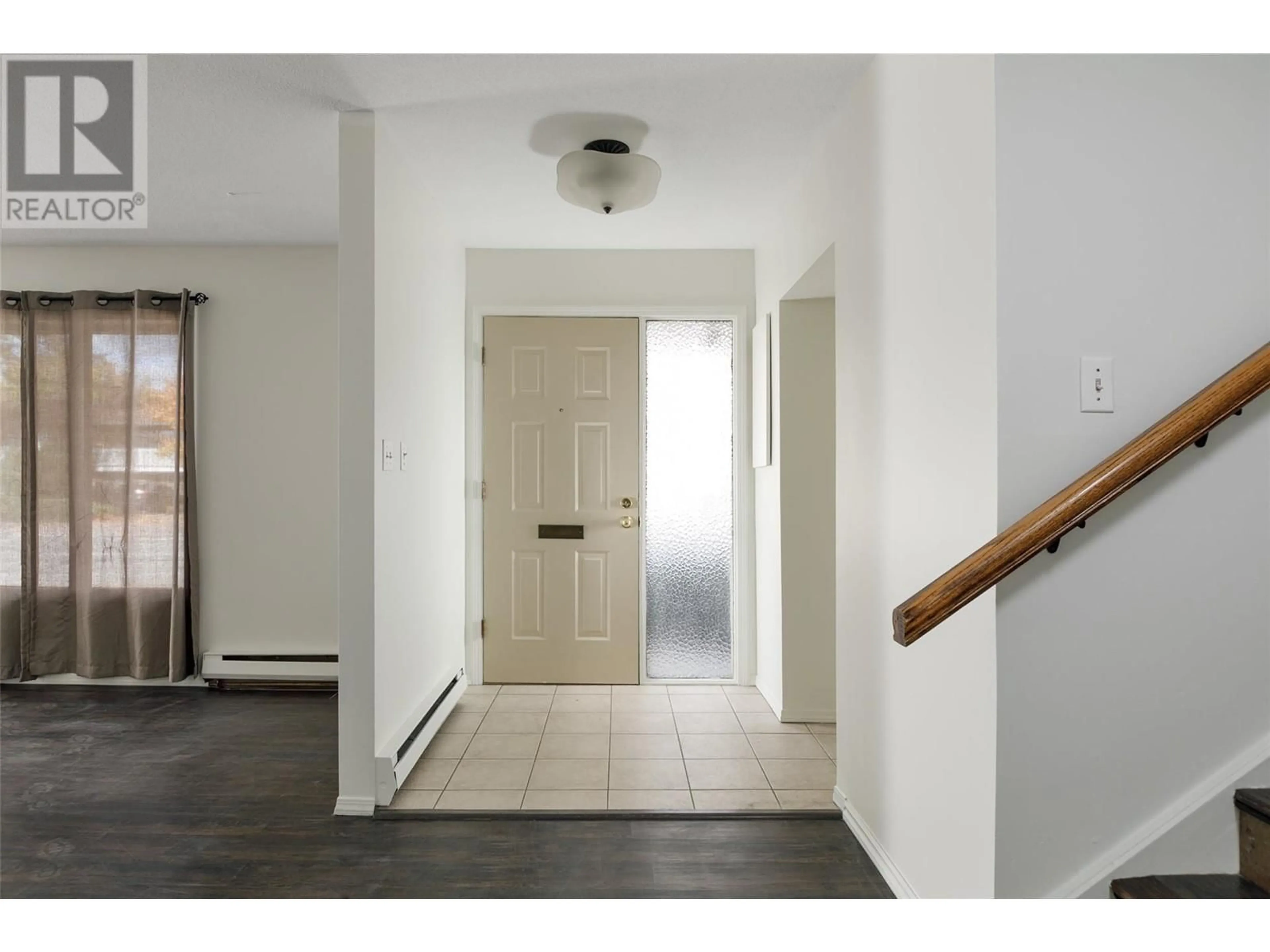 Indoor foyer, wood floors for 1441 Springfield Road, Kelowna British Columbia V1Y5V2