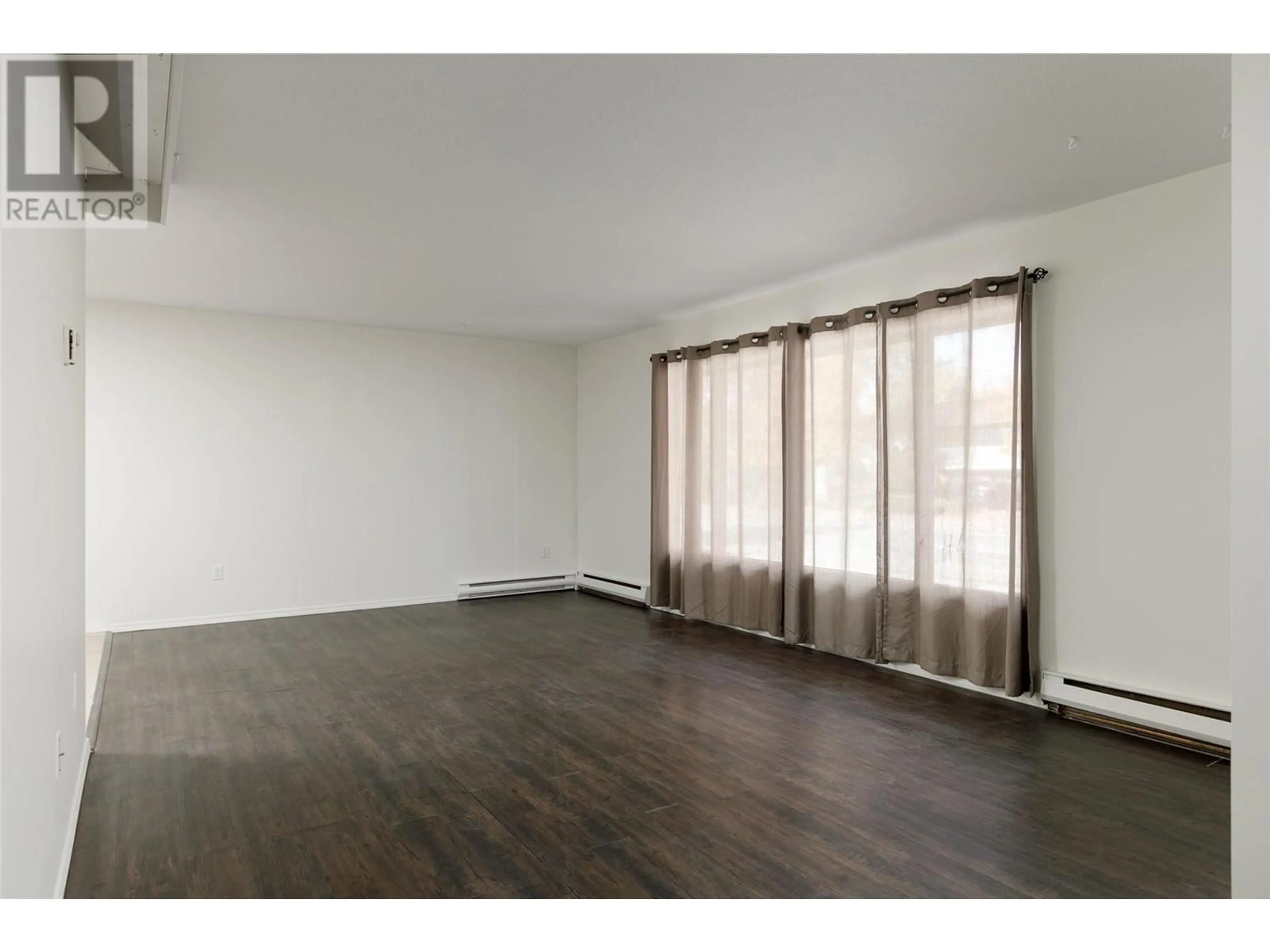 A pic of a room, wood floors for 1441 Springfield Road, Kelowna British Columbia V1Y5V2