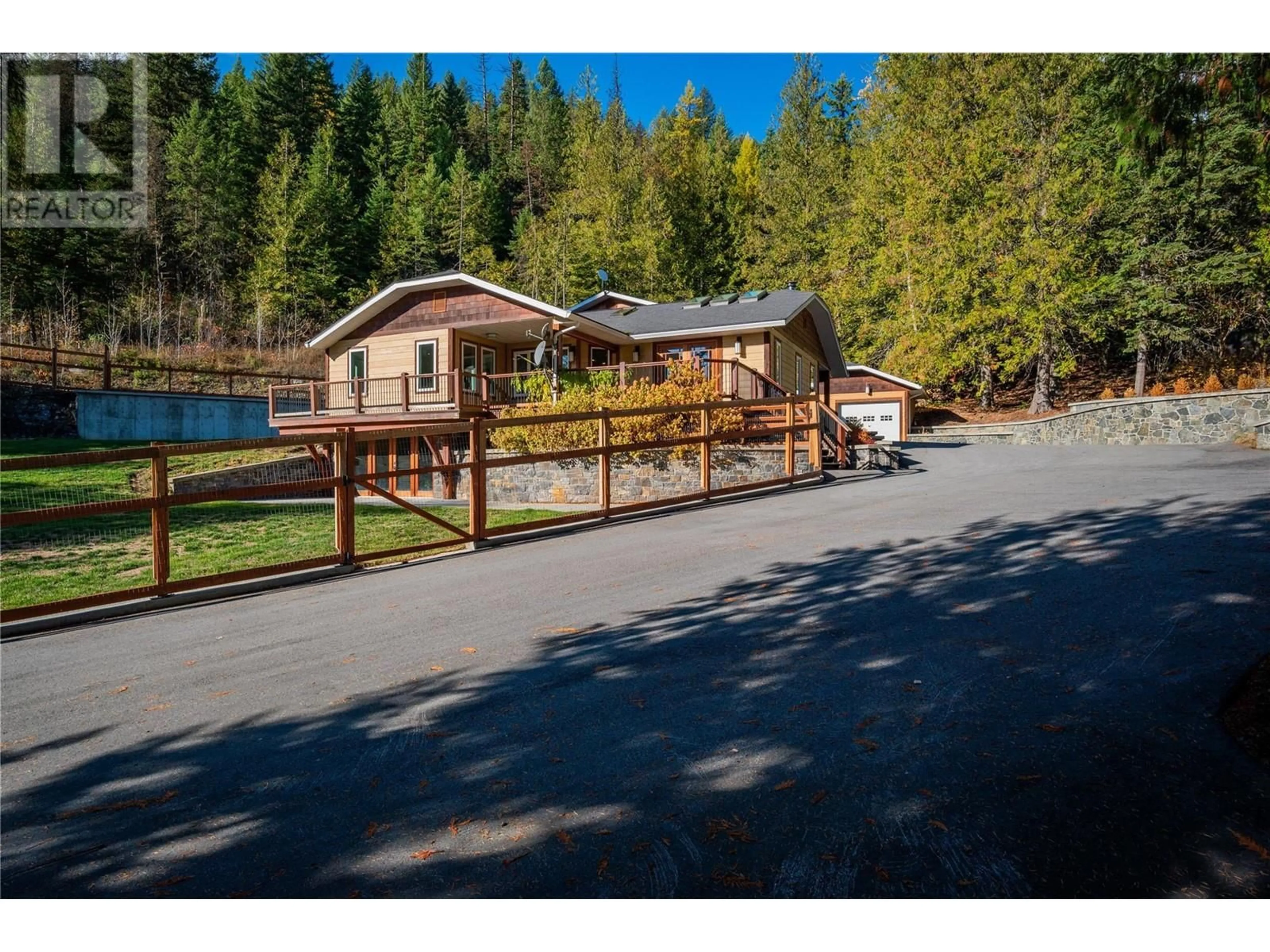 Frontside or backside of a home, the fenced backyard for 635 Highway 22 Highway Lot# A, Rossland British Columbia V0G1Y0