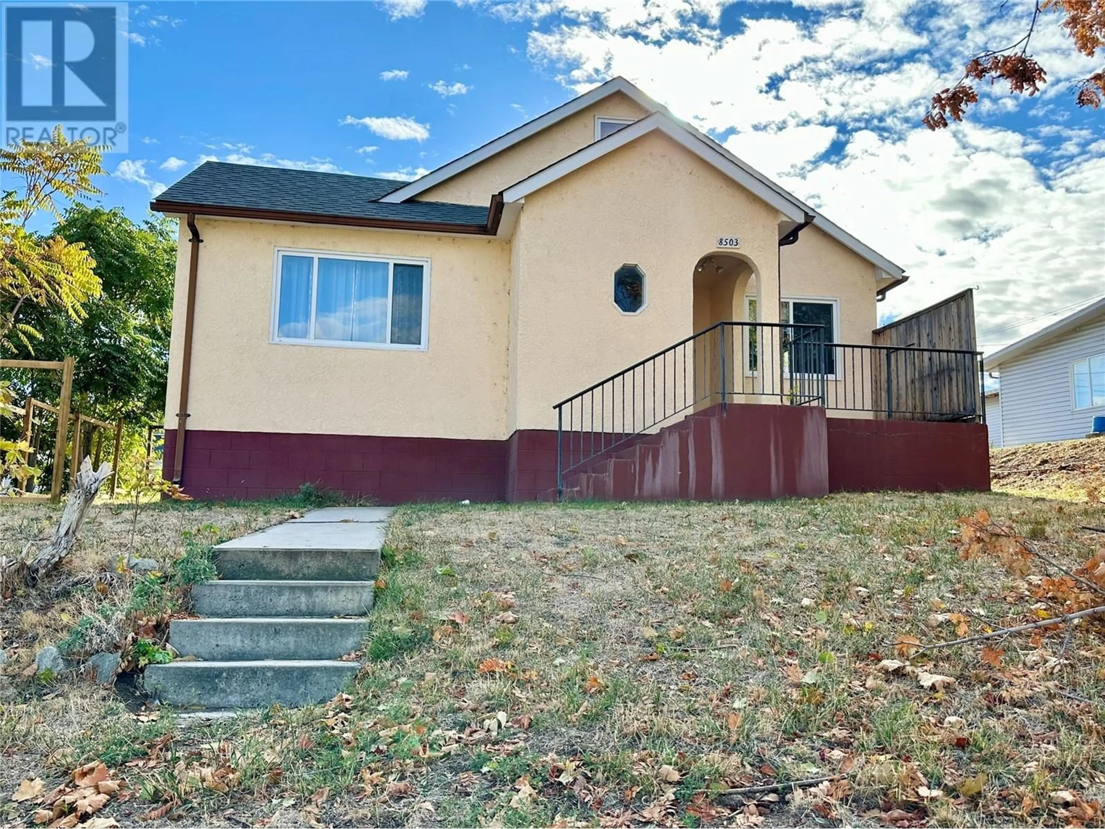 Frontside or backside of a home, the fenced backyard for 8503 72ND Avenue, Osoyoos British Columbia V0H1V2