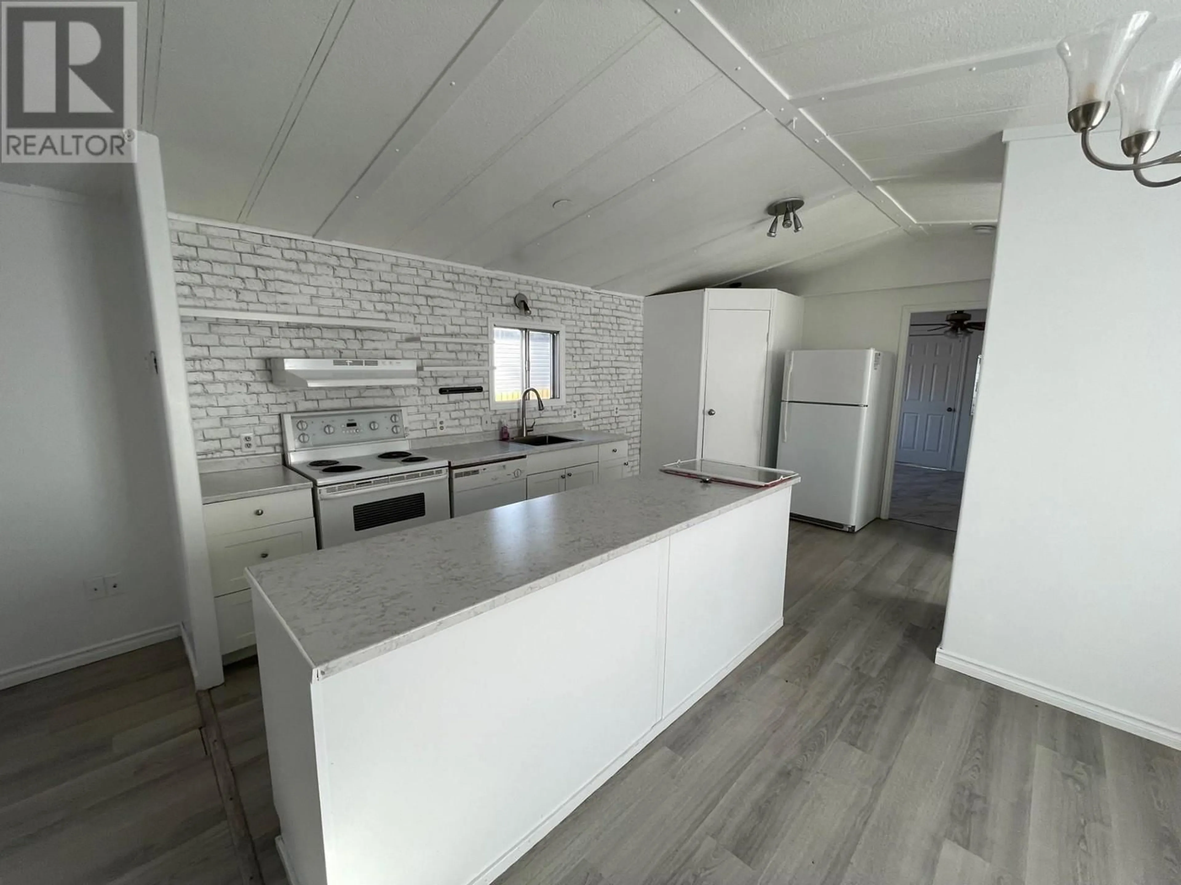 Kitchen, wood floors, cottage for 100 Aspen Drive Unit# 25, Sparwood British Columbia V0B2G0