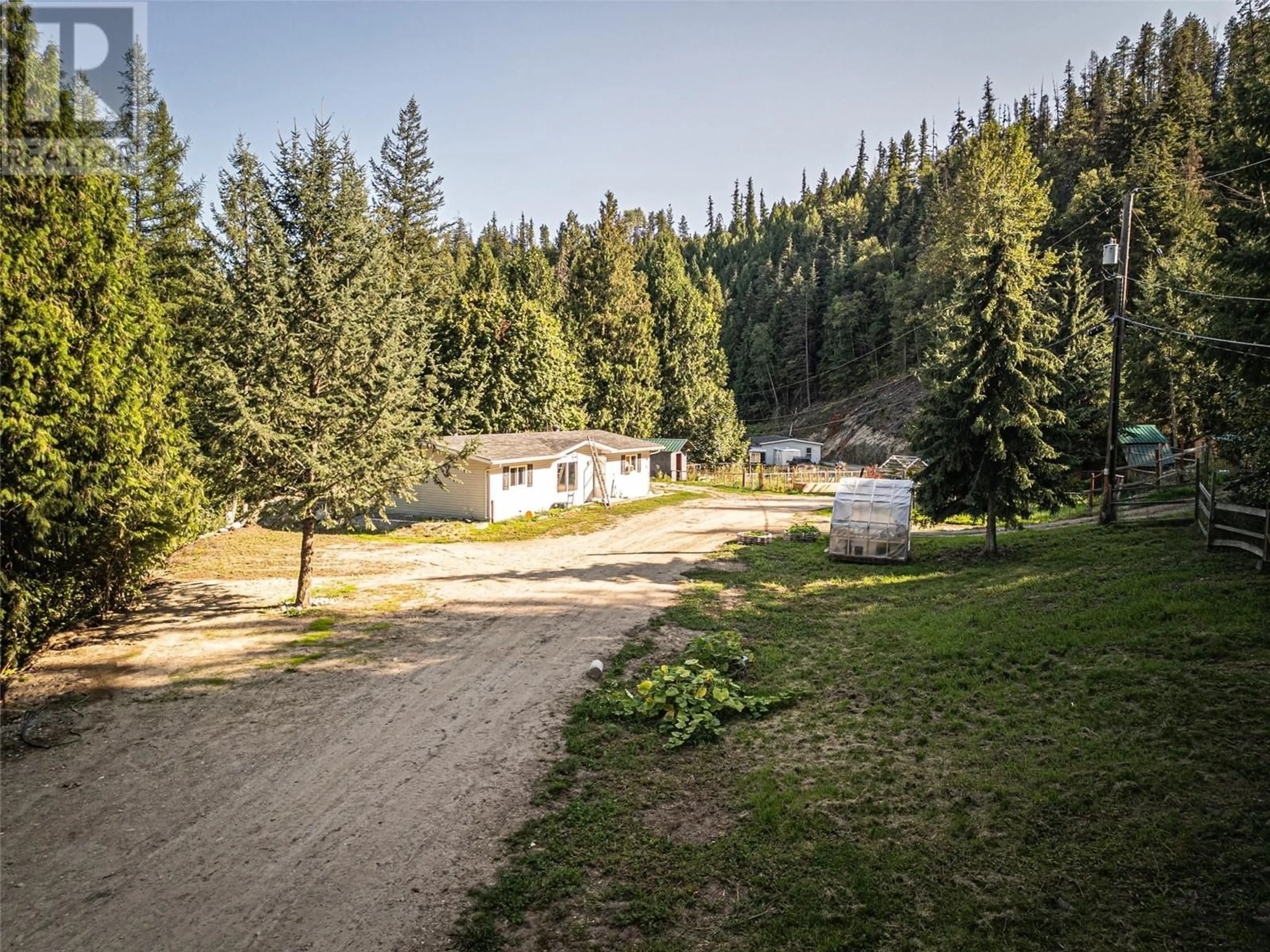 A pic from outside/outdoor area/front of a property/back of a property/a pic from drone, forest/trees view for 1531 Mountain Ridge Road, Robson British Columbia V1N4S2