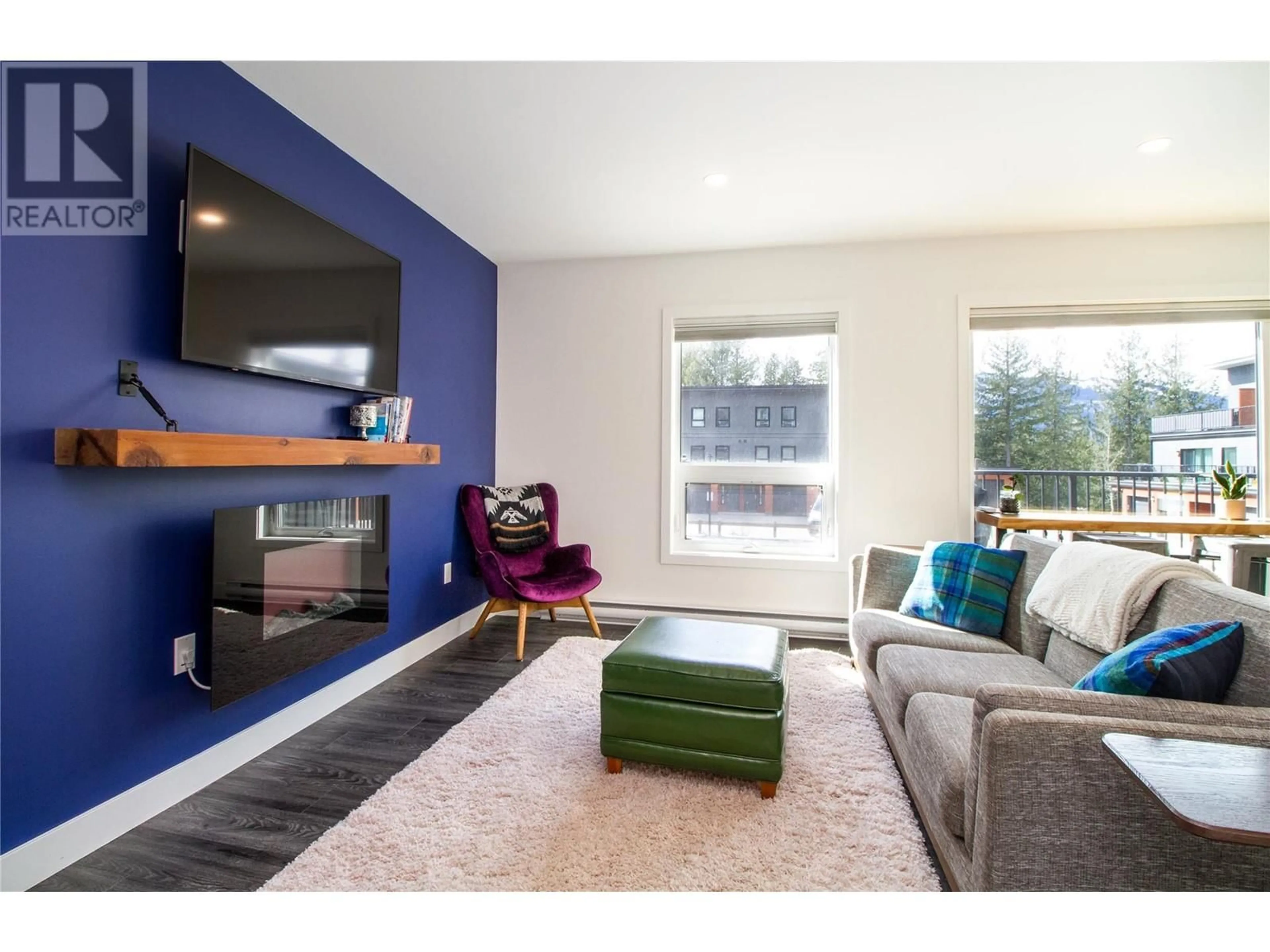 Living room with furniture, wood/laminate floor for 7203 - 1901 NELS NELSON CRESCENT, Revelstoke British Columbia V0E2S3