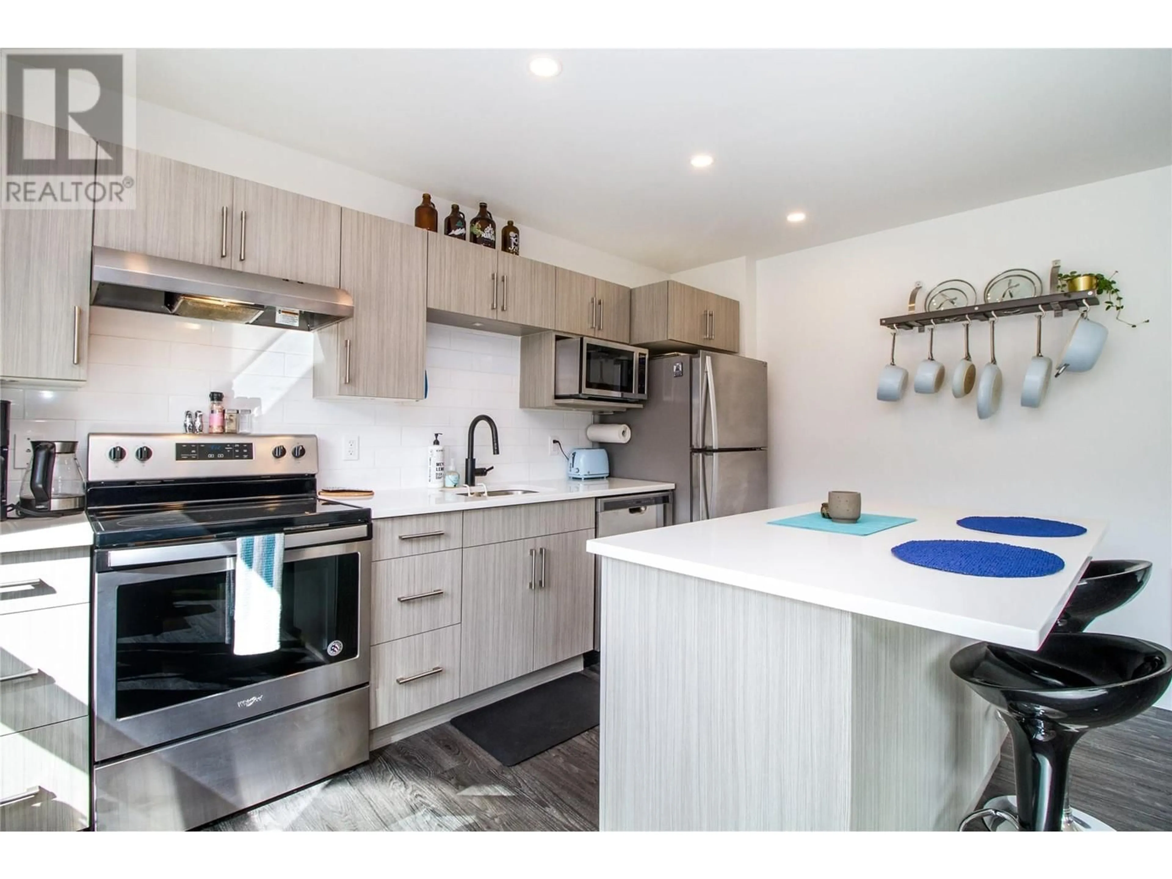 Open concept kitchen, wood/laminate floor for 7203 - 1901 NELS NELSON CRESCENT, Revelstoke British Columbia V0E2S3