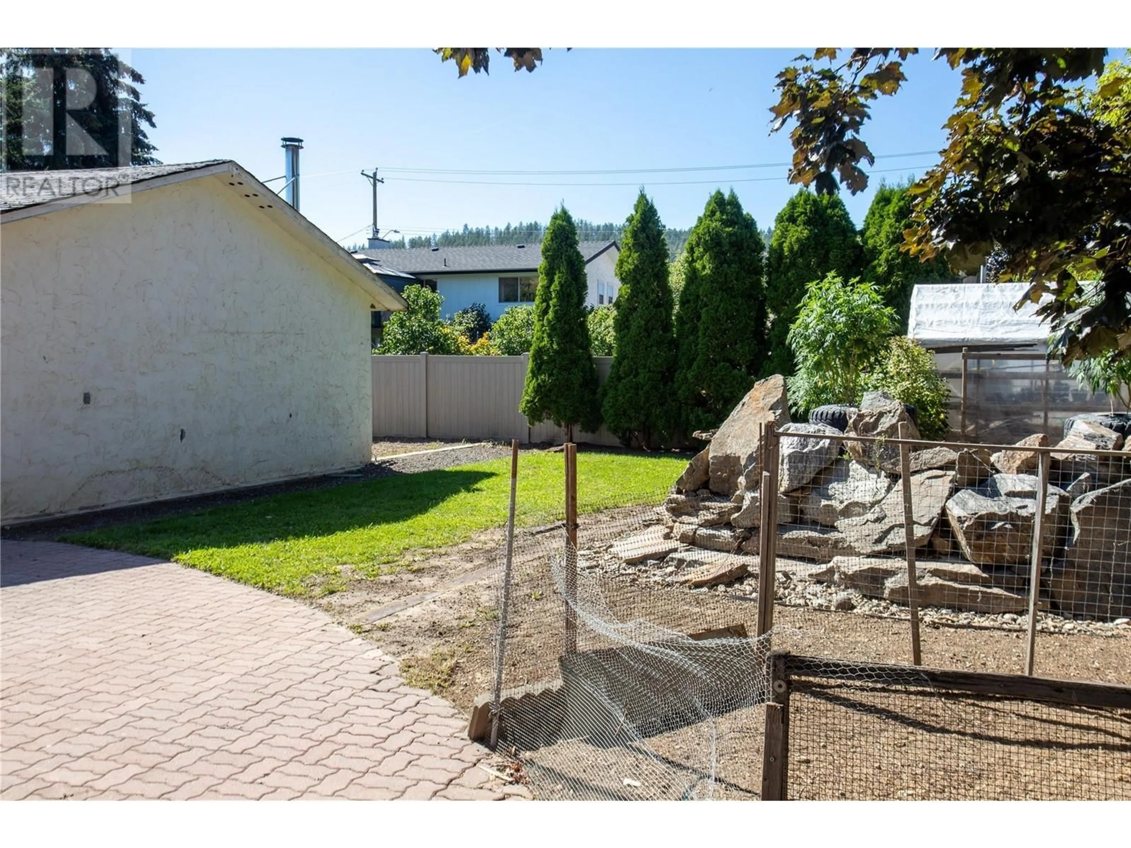 Patio, the fenced backyard for 2140 Hadden Court, Kelowna British Columbia V1P1G8