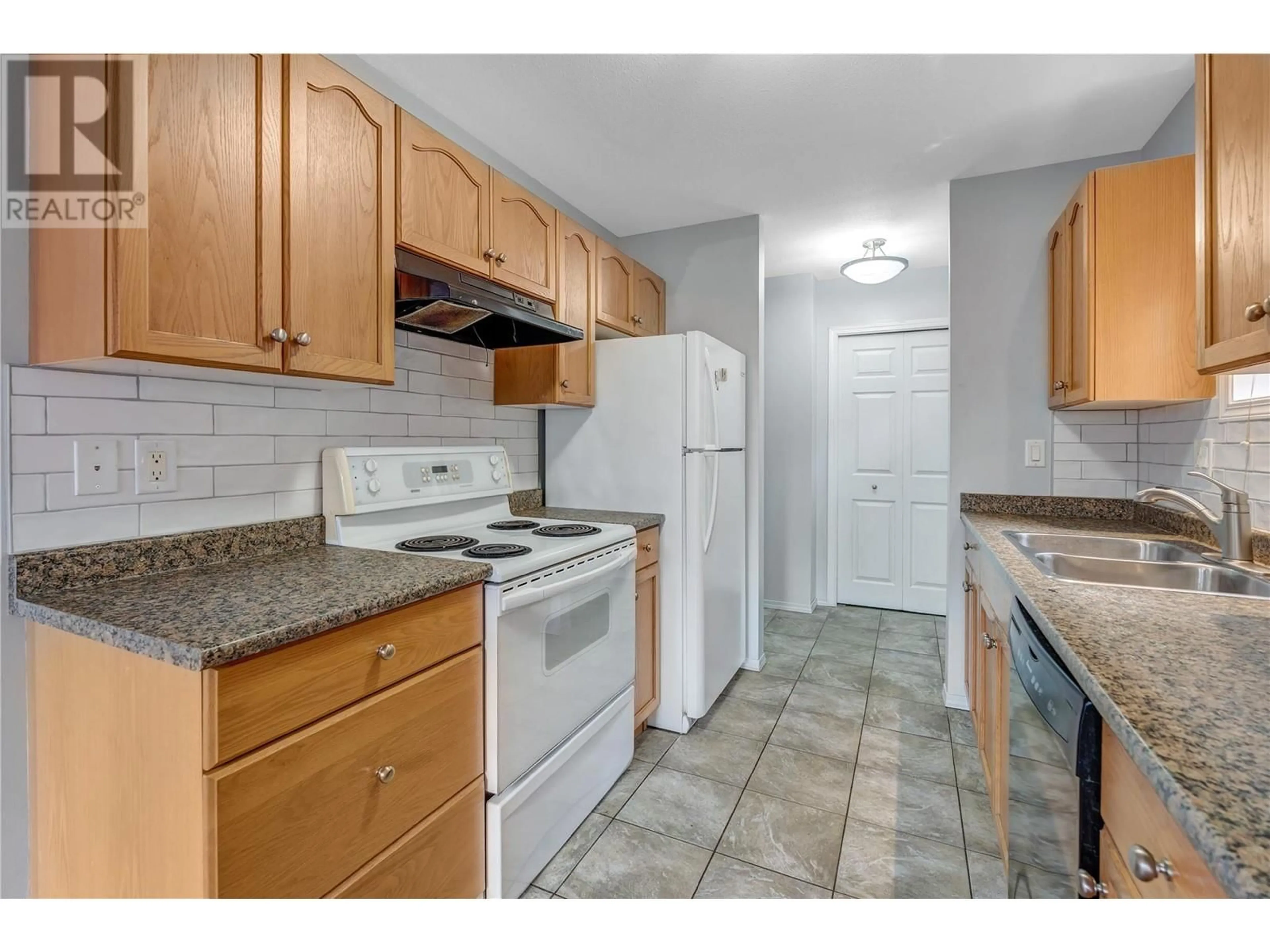 Standard kitchen, carpet floors for 763 Kamloops Avenue Unit# 101, Penticton British Columbia V2A2J3