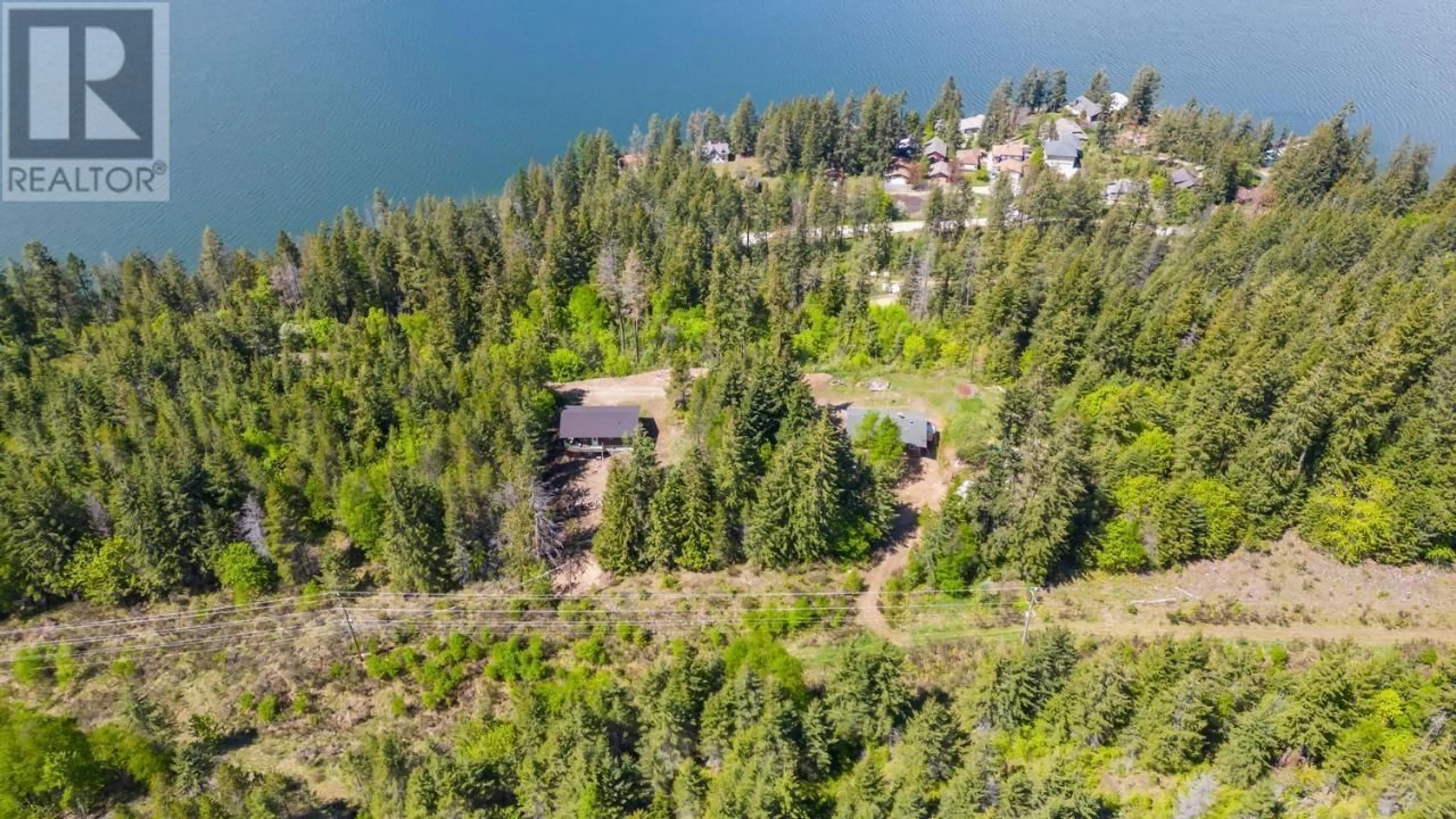 A pic from outside/outdoor area/front of a property/back of a property/a pic from drone, water/lake/river/ocean view for 14504 - & 14506 HIGHWAY 3A OTHER, Gray Creek British Columbia V0B1S0