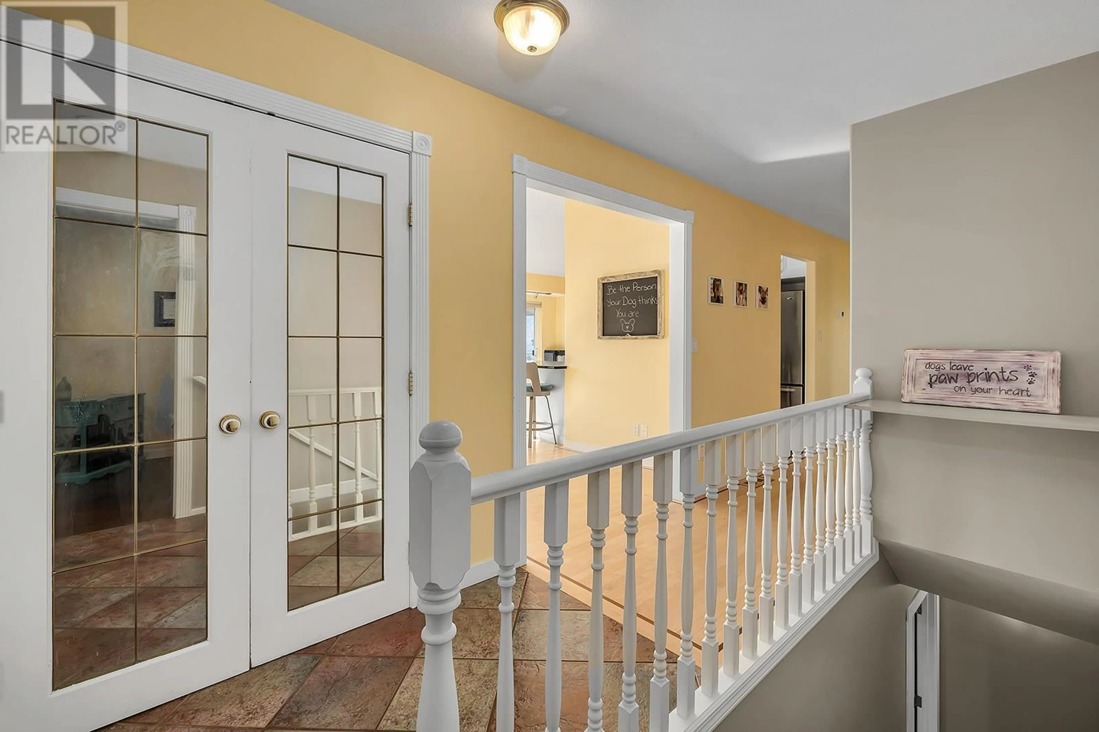 Indoor foyer, wood floors for 6212 Haker Place, Peachland British Columbia V0H1X8