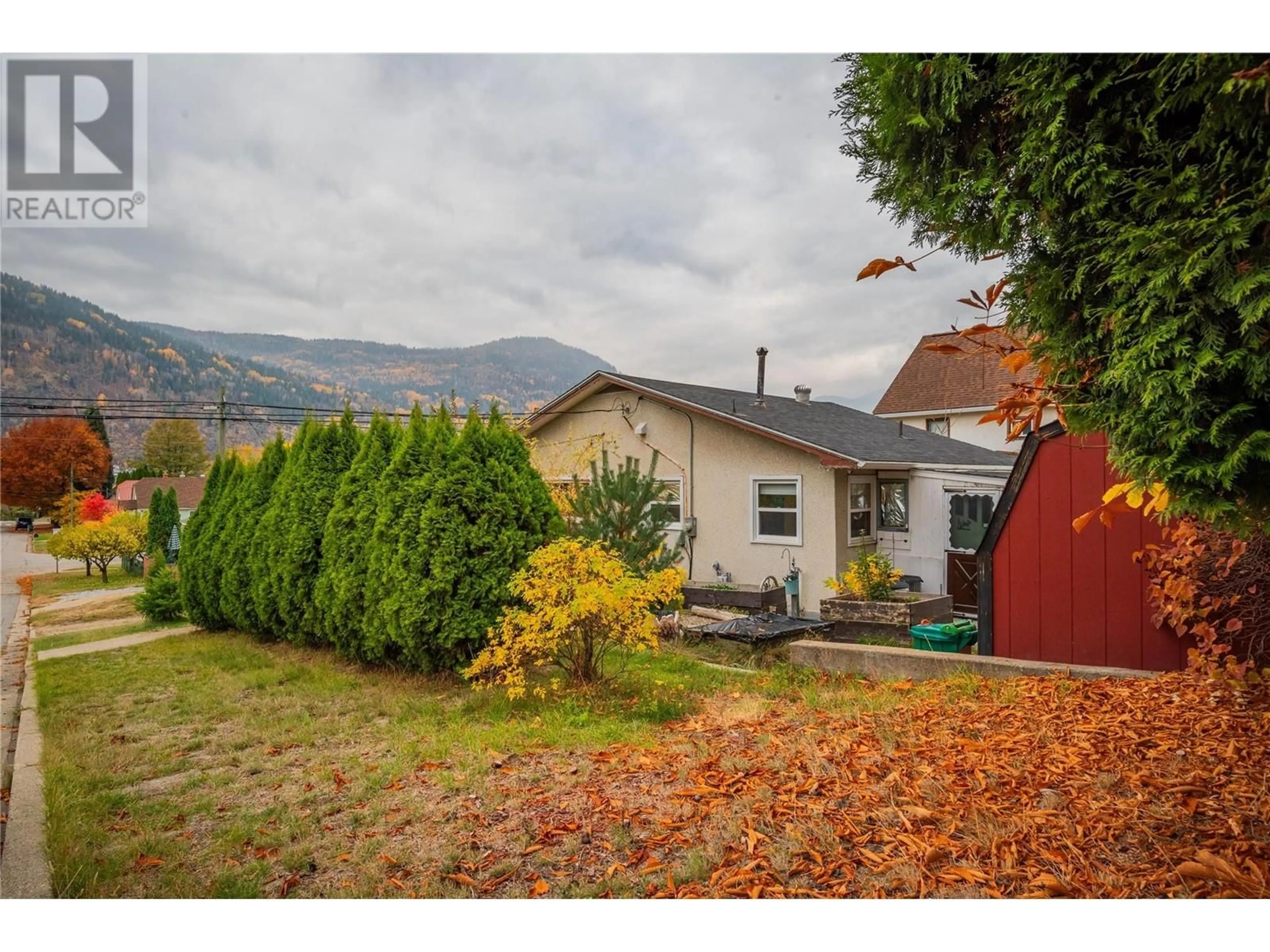 Frontside or backside of a home, the fenced backyard for 2196 Eighth Avenue, Trail British Columbia V1R3E2