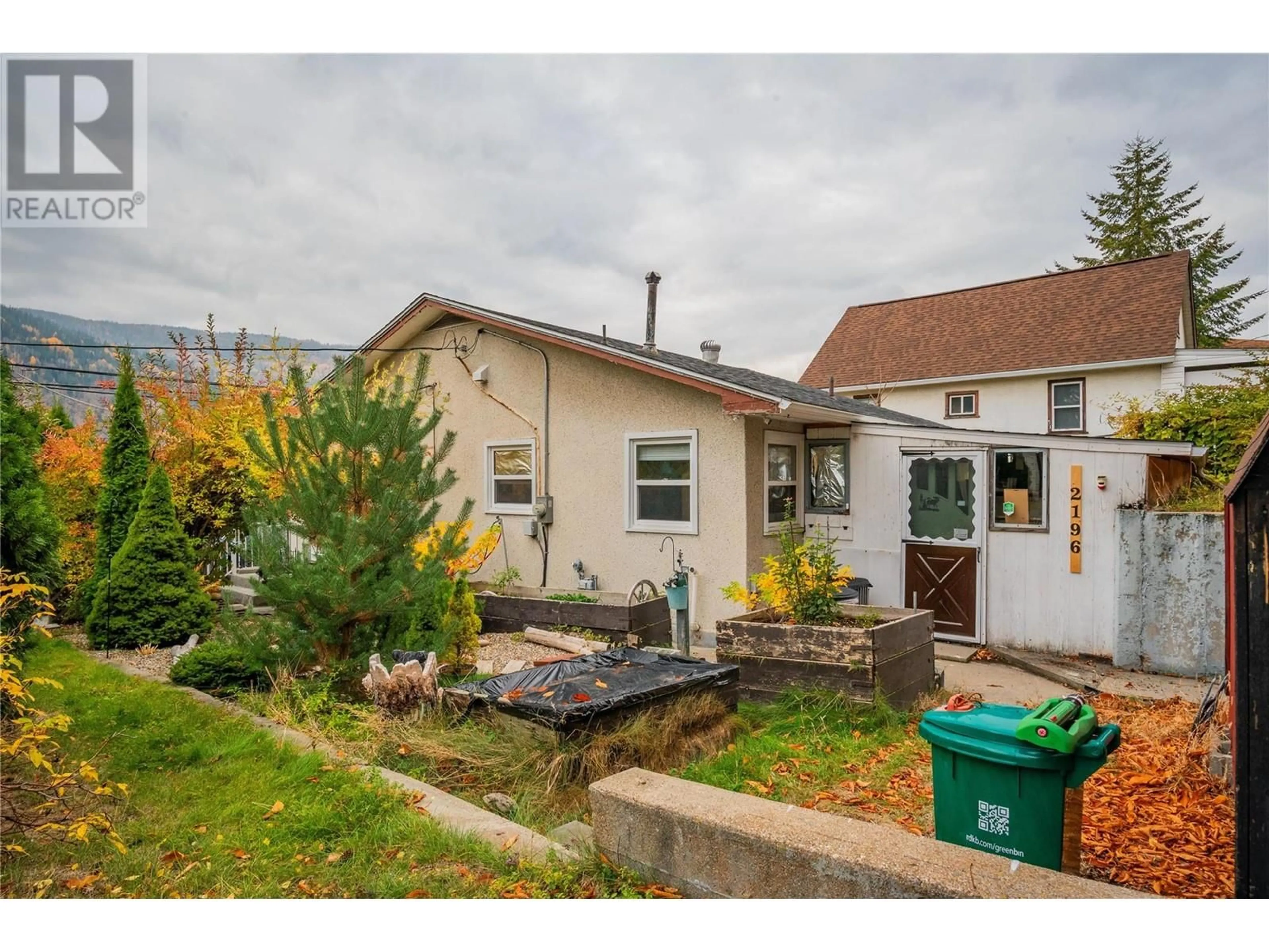 Frontside or backside of a home, the fenced backyard for 2196 Eighth Avenue, Trail British Columbia V1R3E2