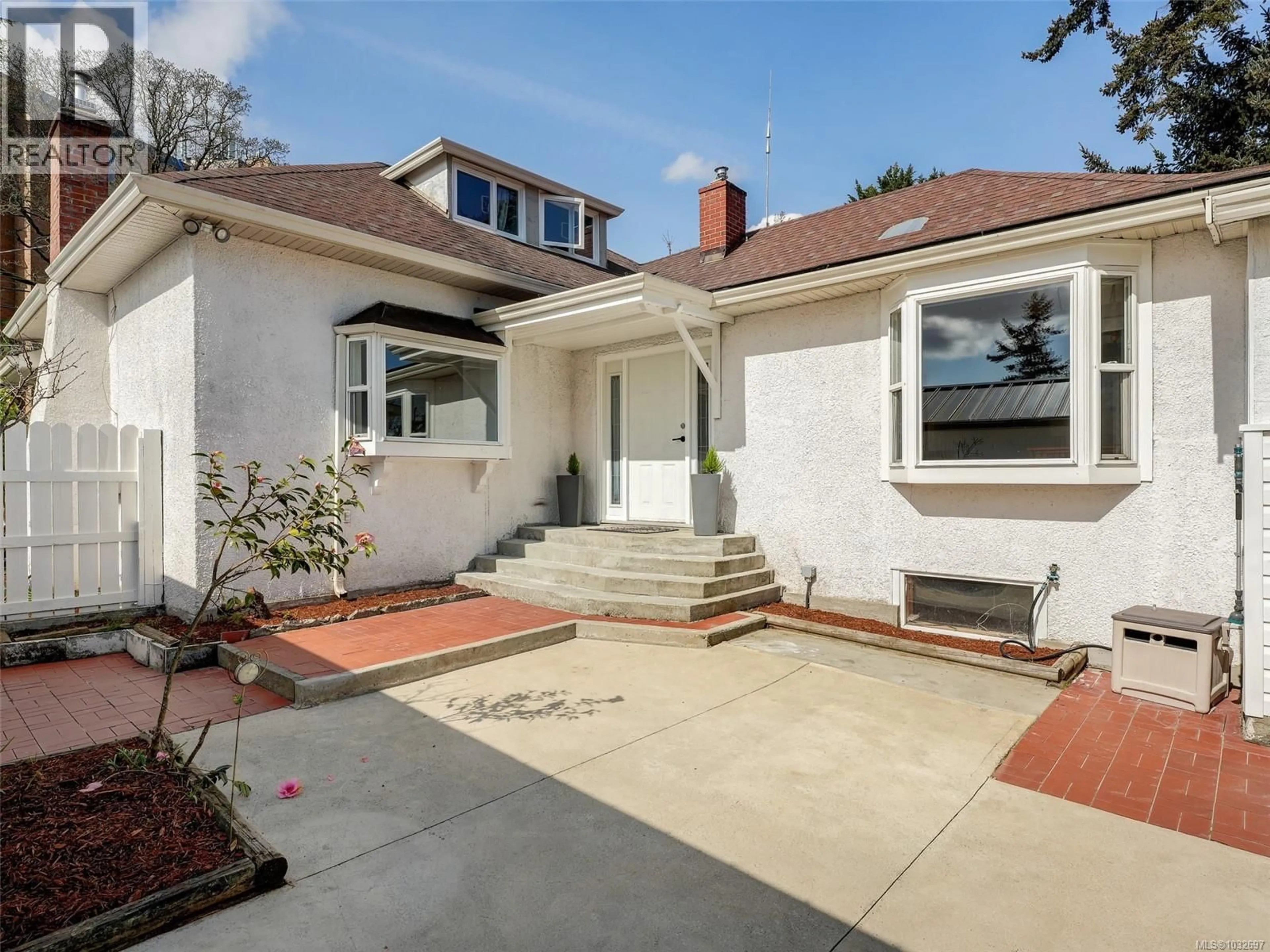 Home with brick exterior material, street for 4031 QUADRA STREET, Saanich British Columbia V8X1K1