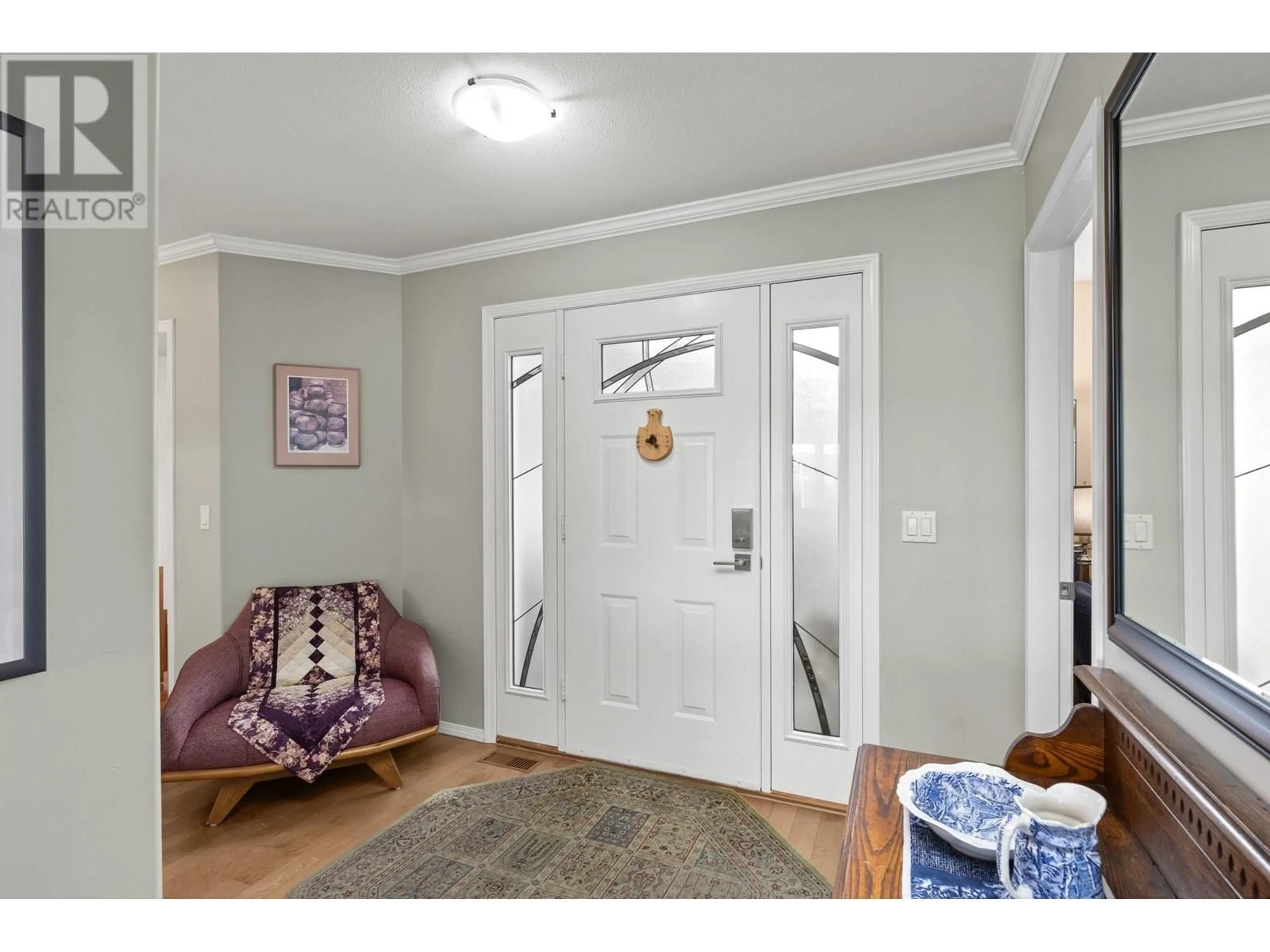 Indoor entryway, wood floors for 1082 Lanfranco Road, Kelowna British Columbia V1W3W5