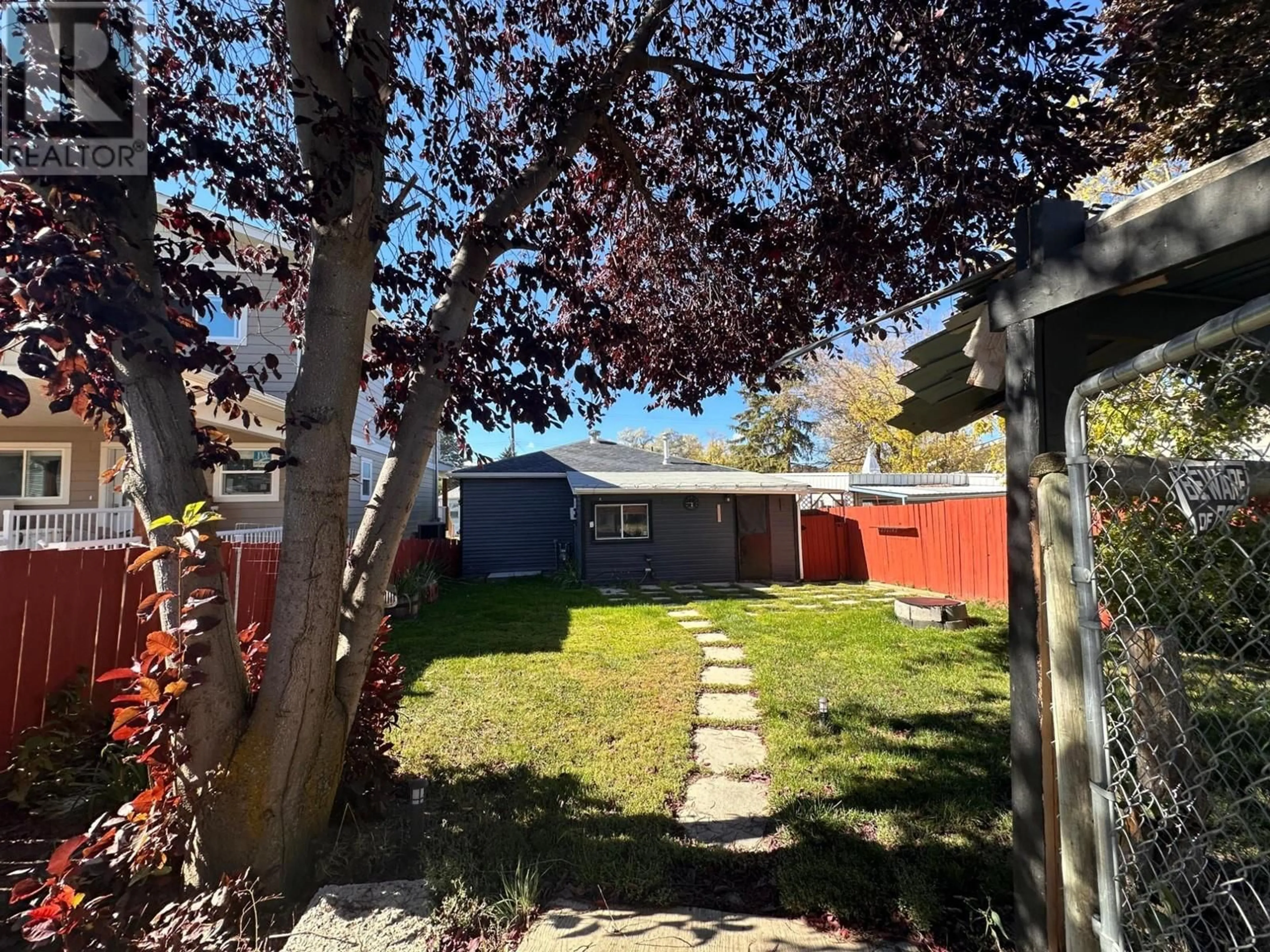 Frontside or backside of a home, the fenced backyard for 306 5TH AVENUE S Avenue, Cranbrook British Columbia V1C2G6