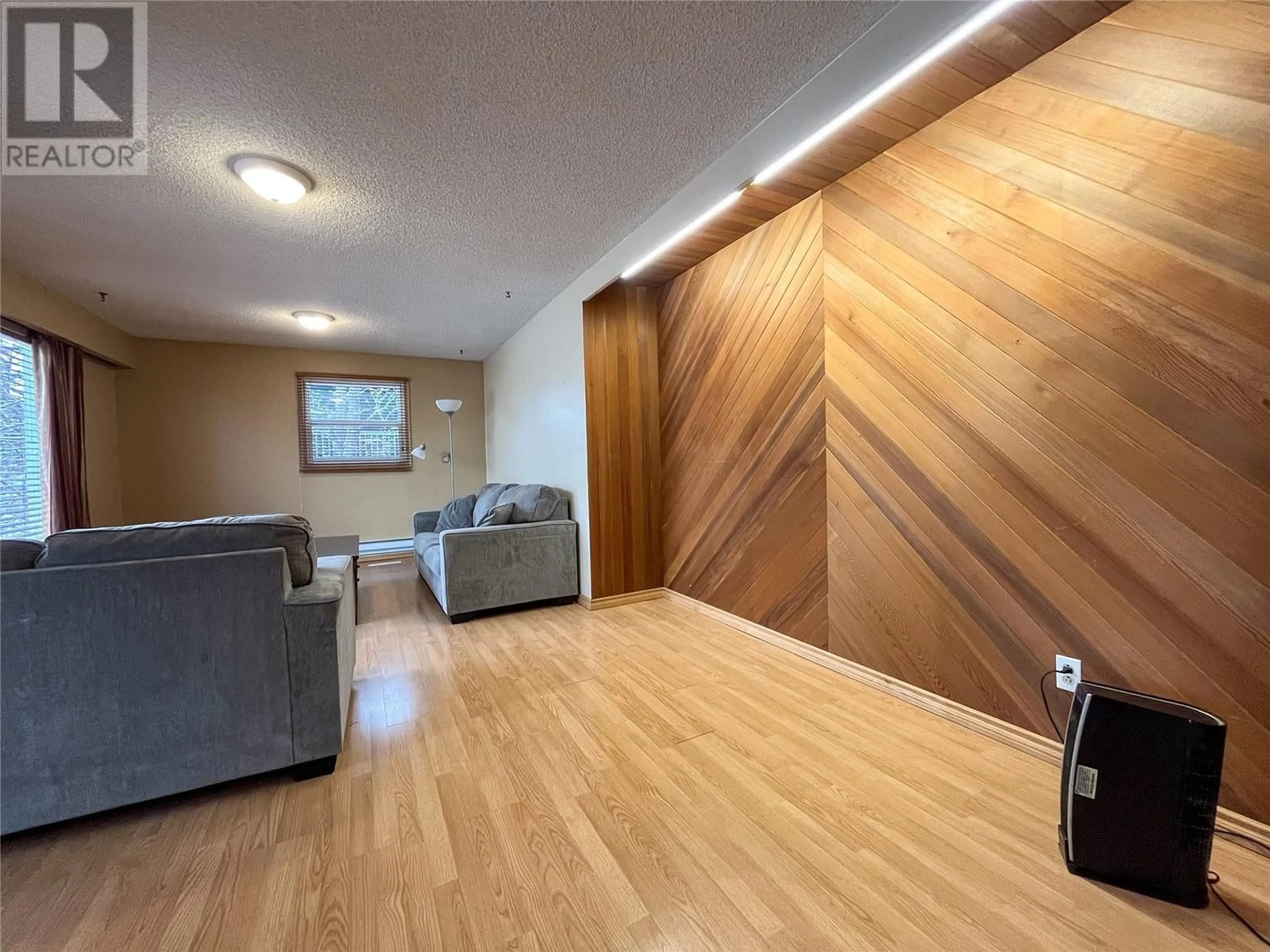 A pic of a room, wood floors for 9204 9 Street, Dawson Creek British Columbia V1G3S2