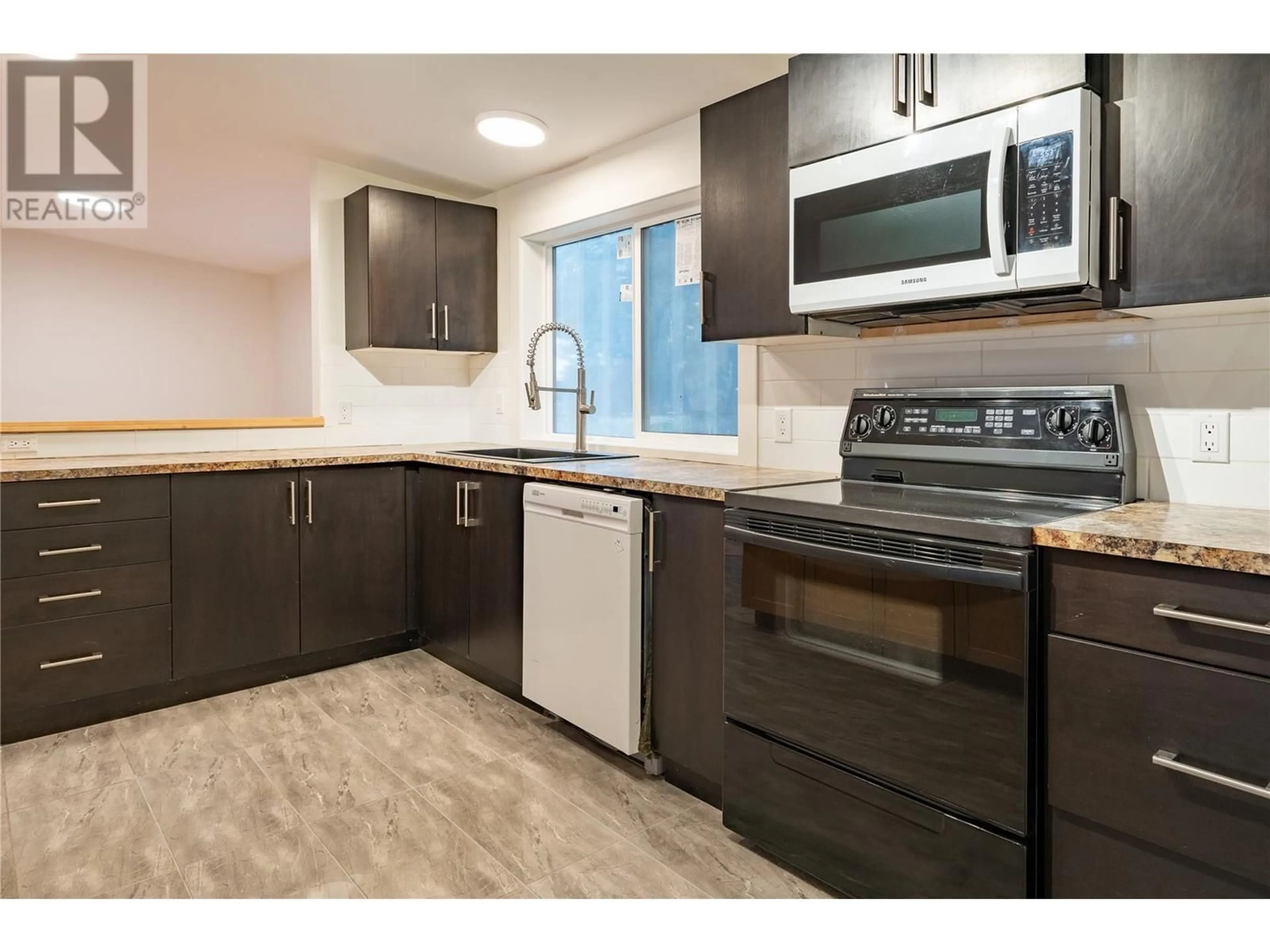 Standard kitchen, wood/laminate floor for 1079 Lundell Road Unit# 14, Revelstoke British Columbia V0E2S0