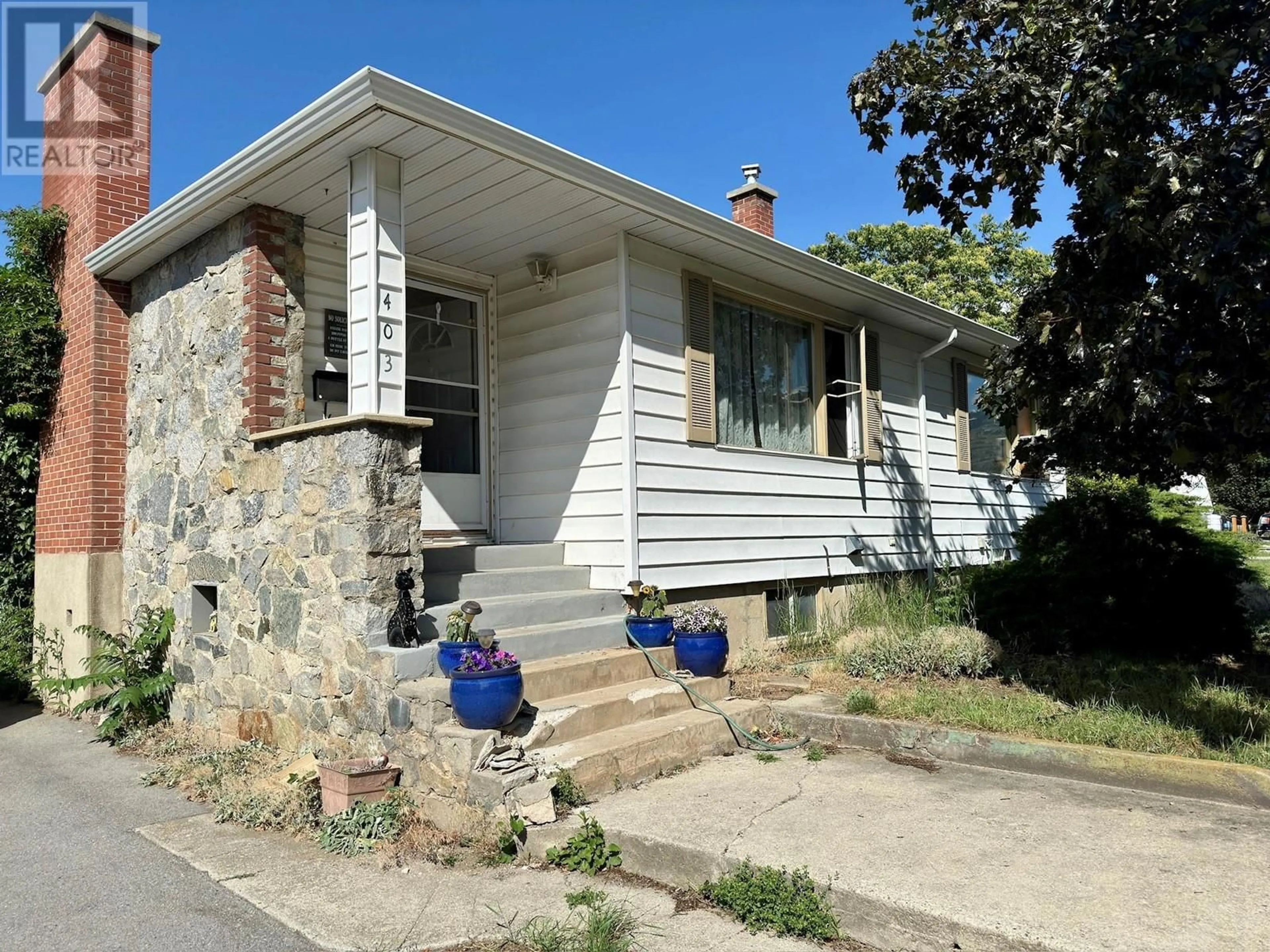 Frontside or backside of a home, the street view for 403 Conklin Avenue, Penticton British Columbia V2A2T3