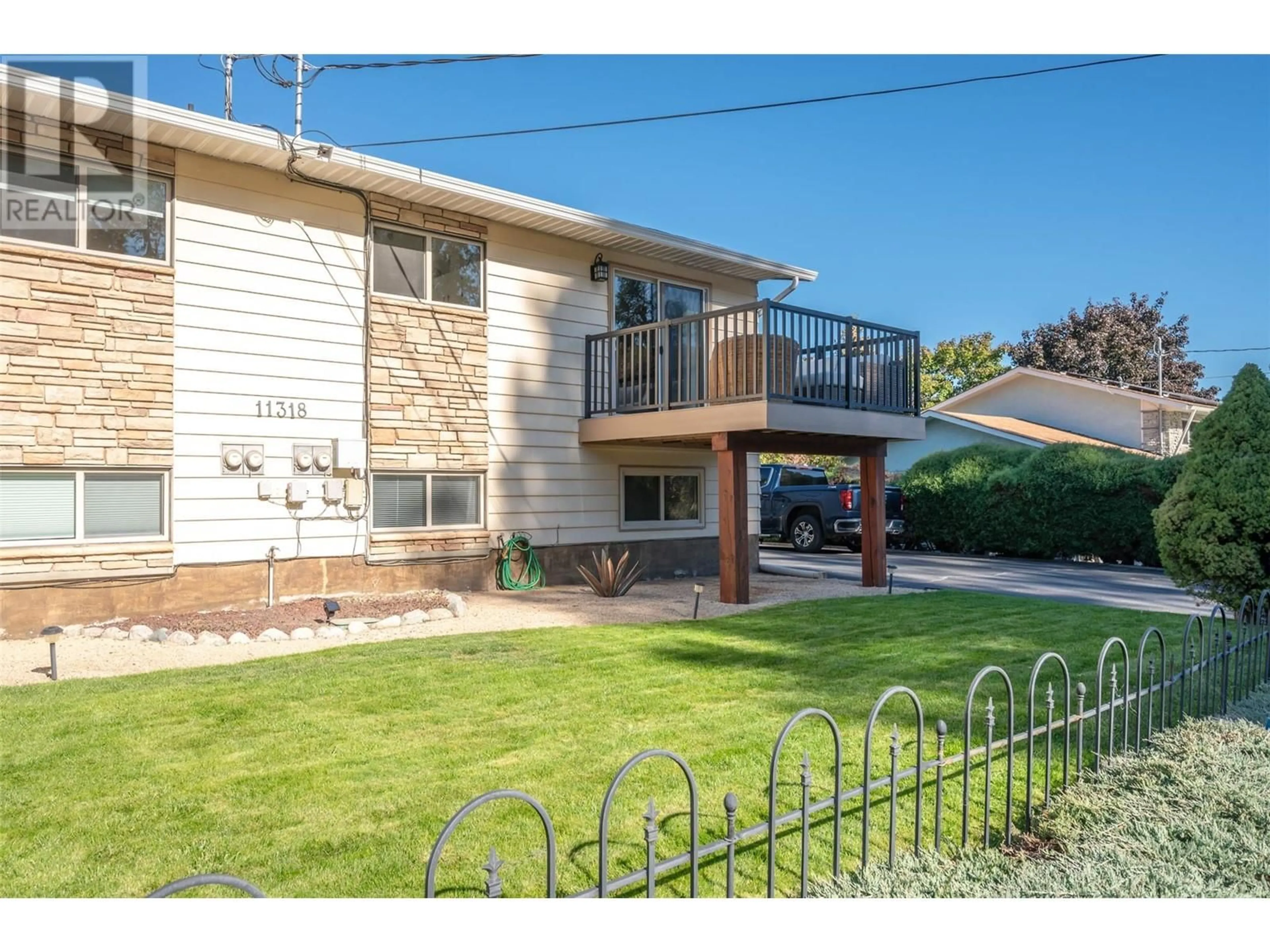 Frontside or backside of a home, the fenced backyard for 11318 Jubilee Road Unit# 1, Summerland British Columbia V0H1Z0