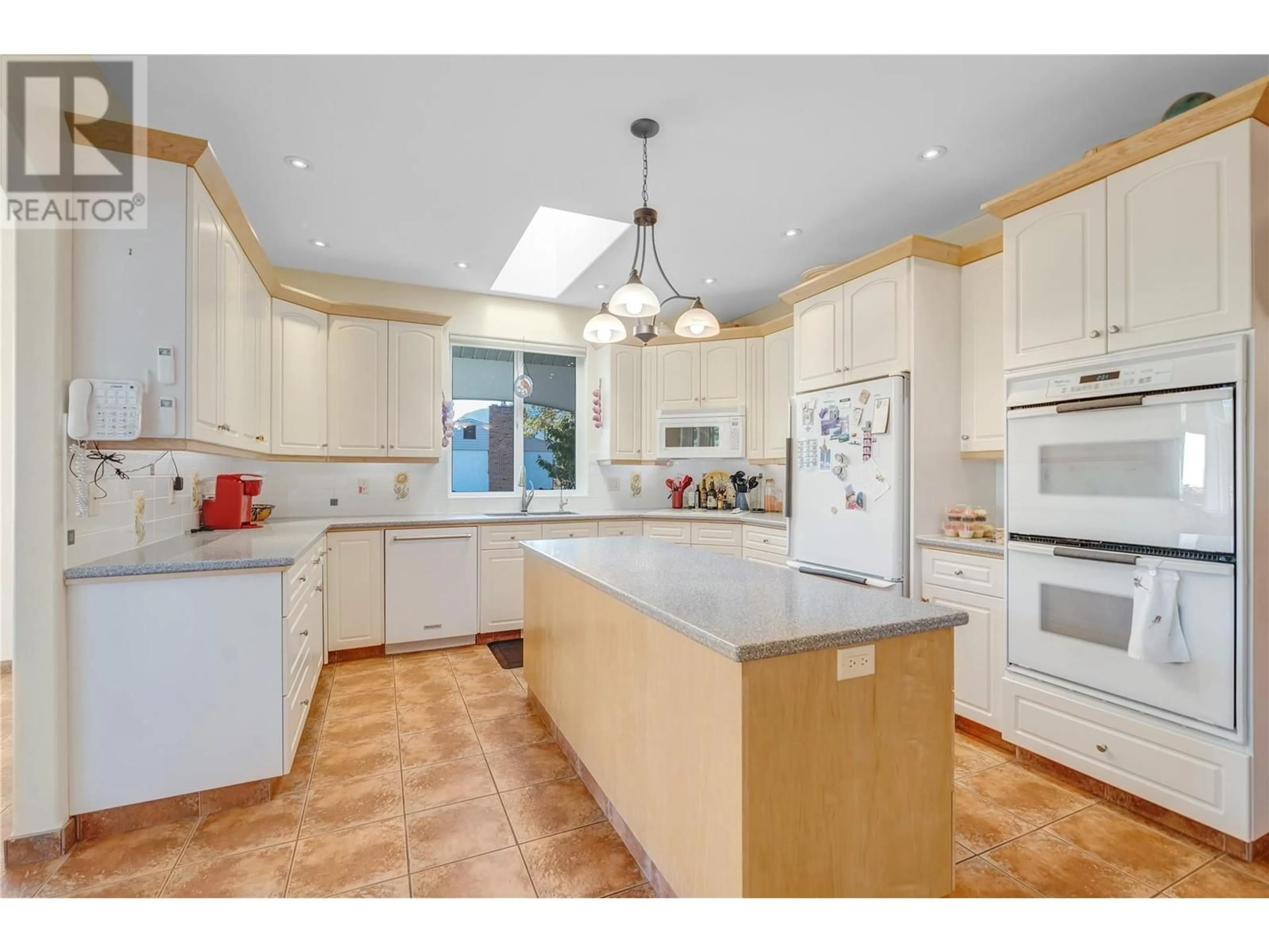 Open concept kitchen for 5611 Woods Avenue, Summerland British Columbia V0H1Z9