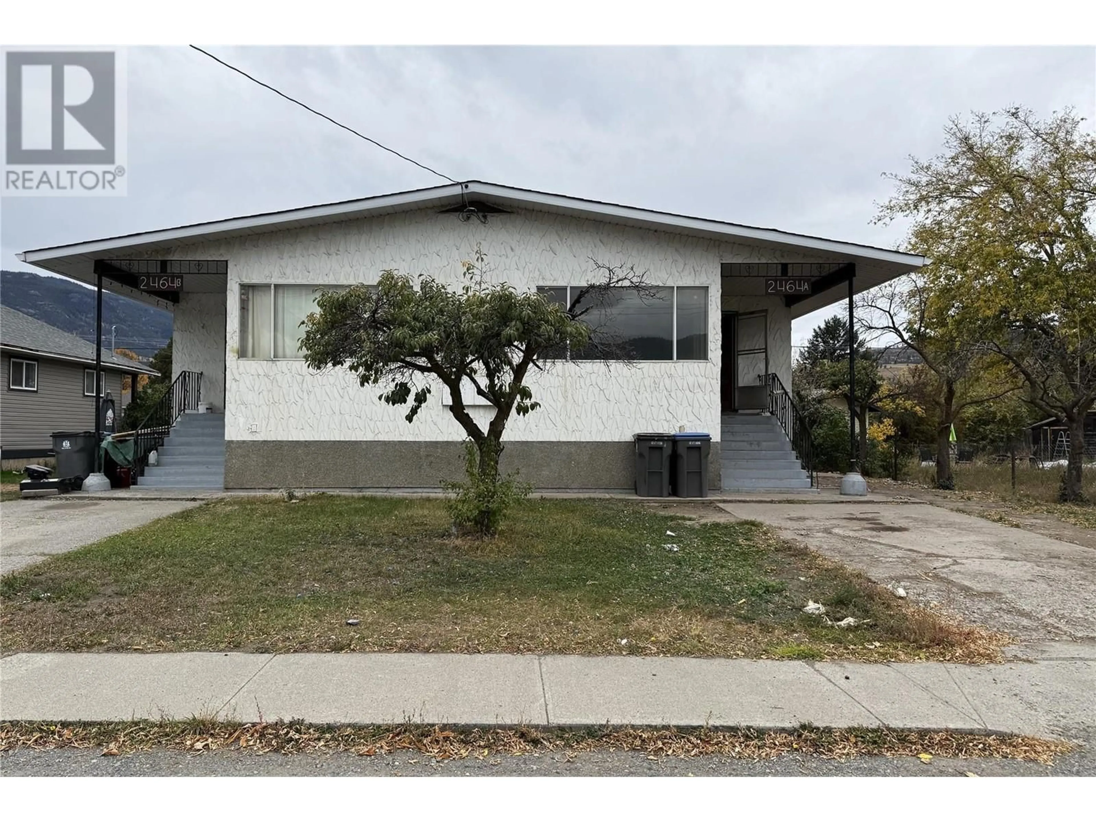 Home with vinyl exterior material, street for 2464 JACKSON AVENUE, Merritt British Columbia V1K1B8