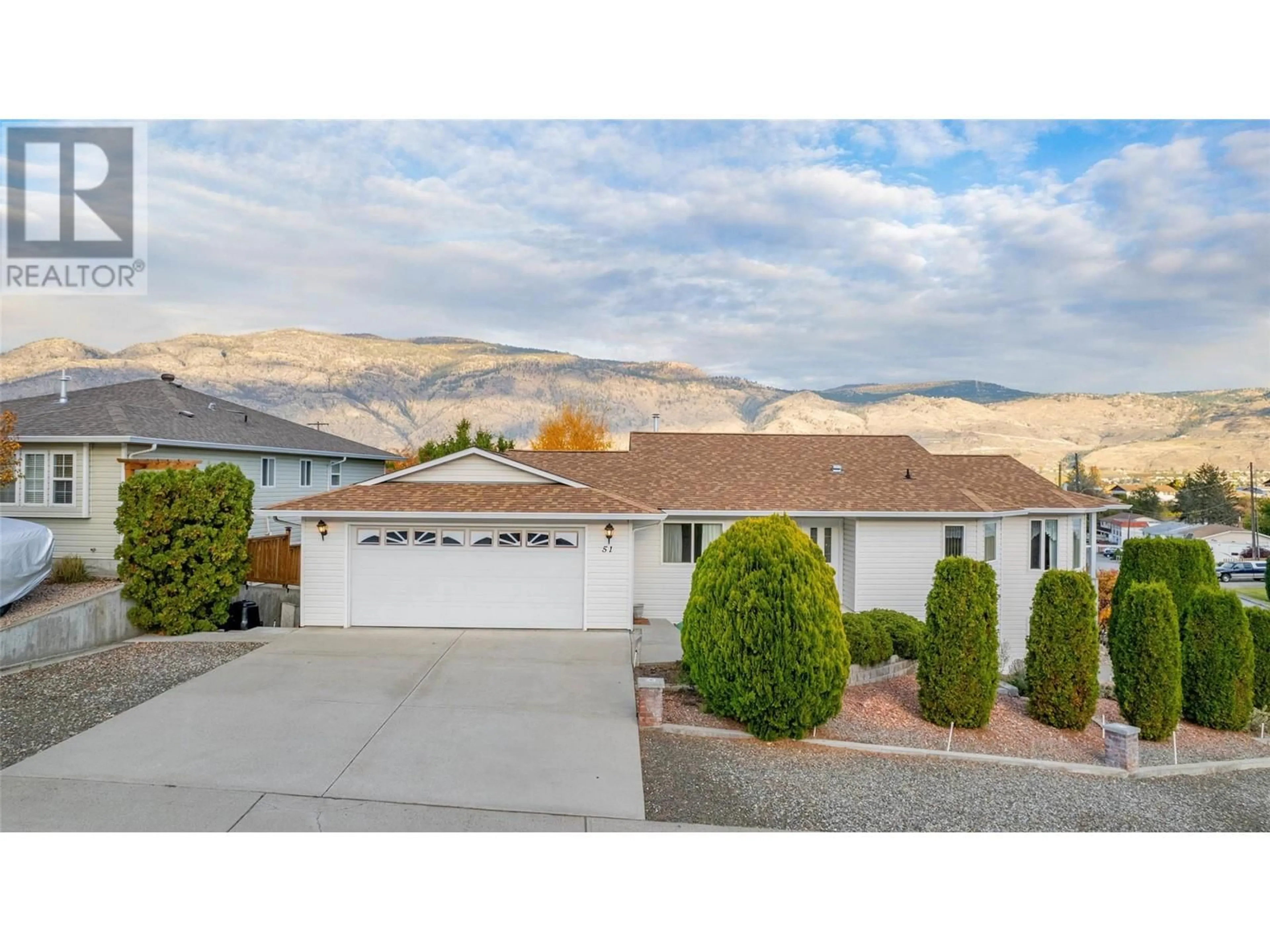 Frontside or backside of a home, the street view for 51 Cactus Crescent, Osoyoos British Columbia V0H1V1