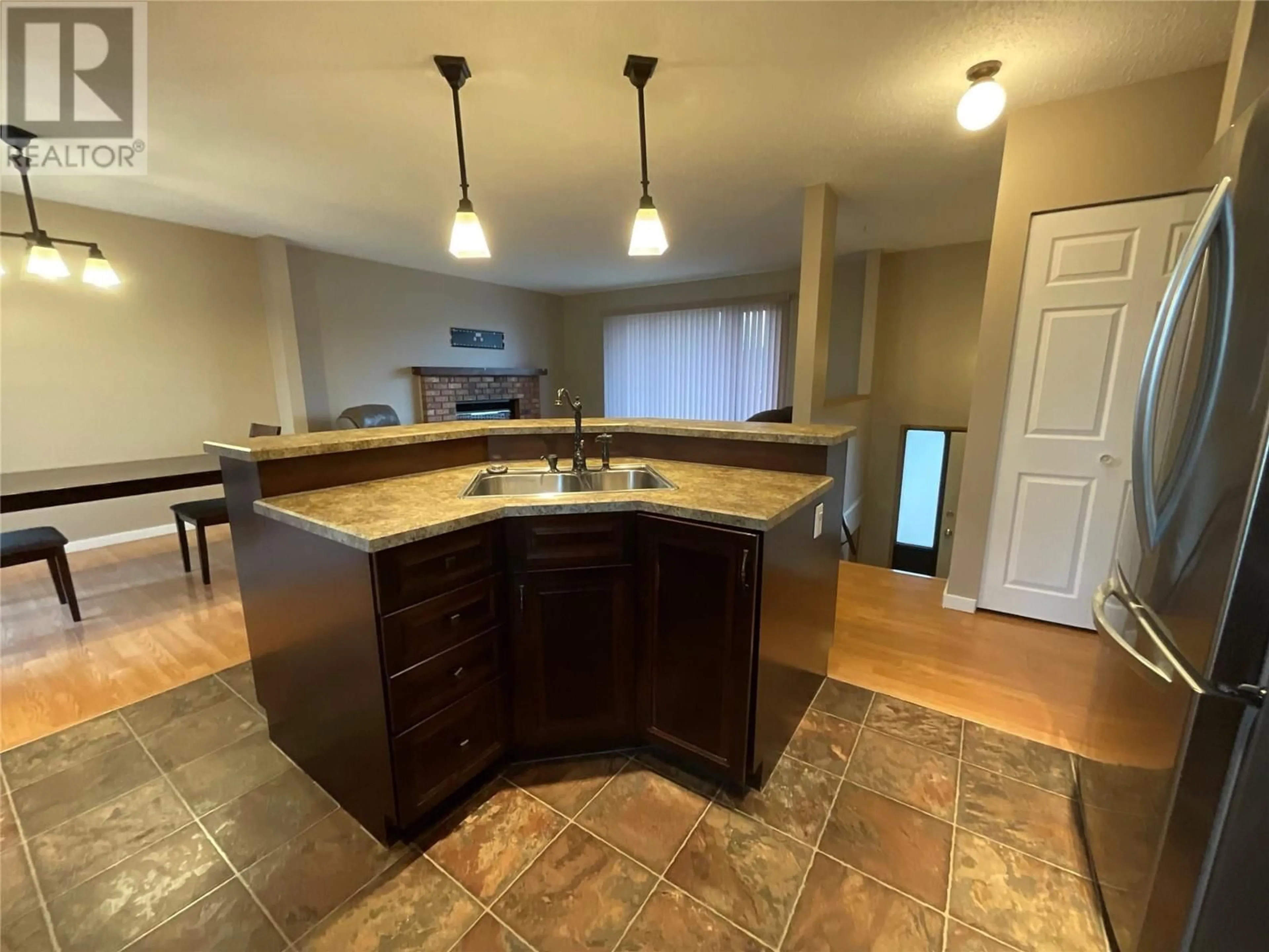 Open concept kitchen for 208 Willow Drive, Tumbler Ridge British Columbia V0C2W0