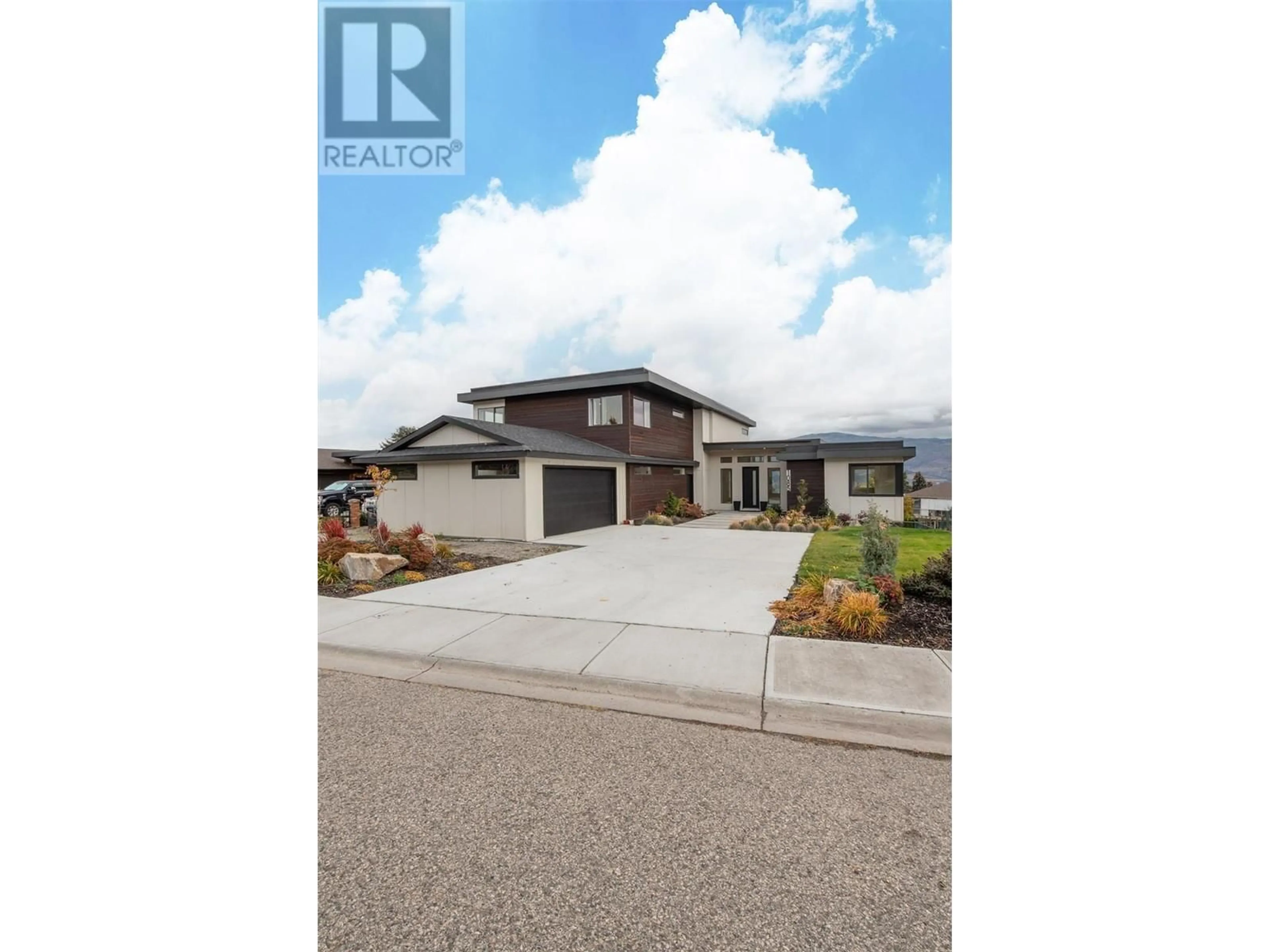 Frontside or backside of a home, the street view for 1085 Aubrey Road, West Kelowna British Columbia V1Z2V9