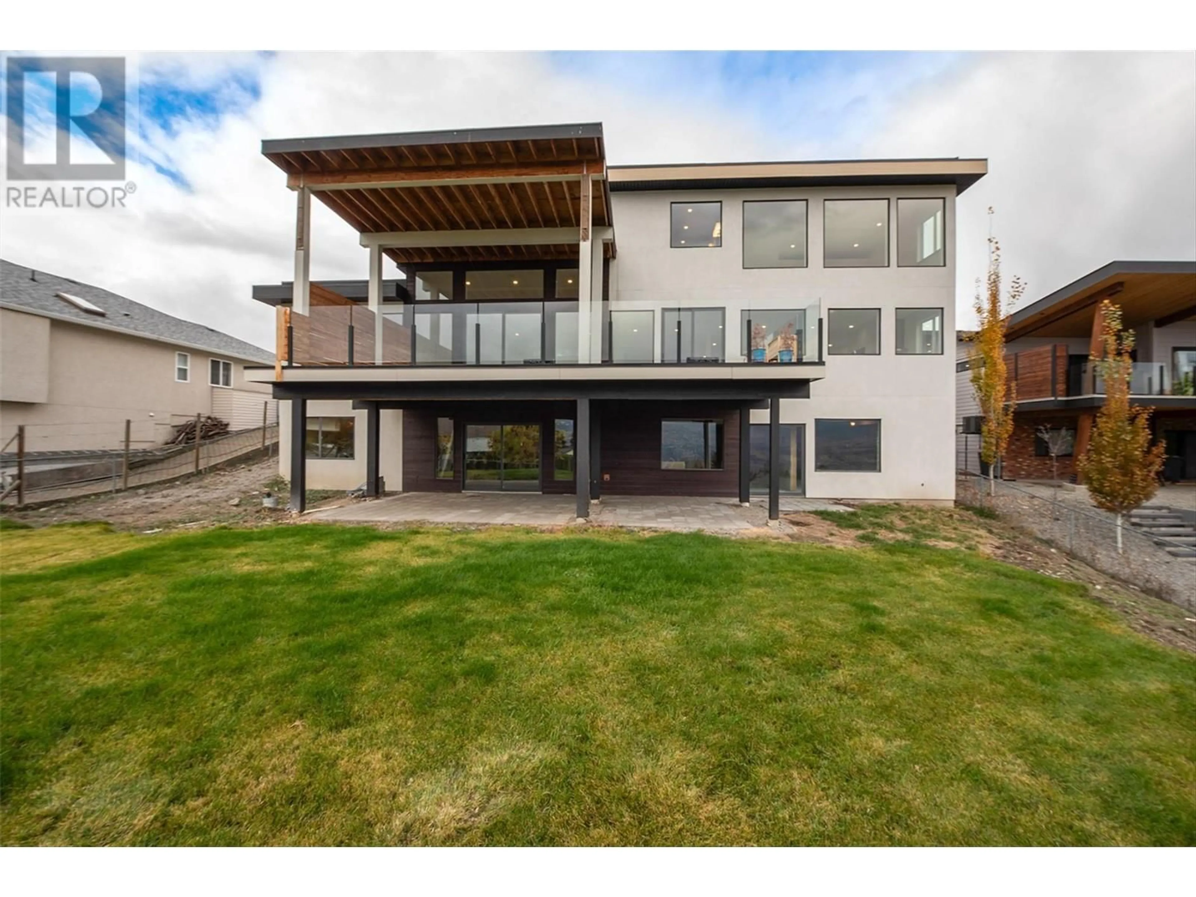 Frontside or backside of a home, the fenced backyard for 1085 Aubrey Road, West Kelowna British Columbia V1Z2V9